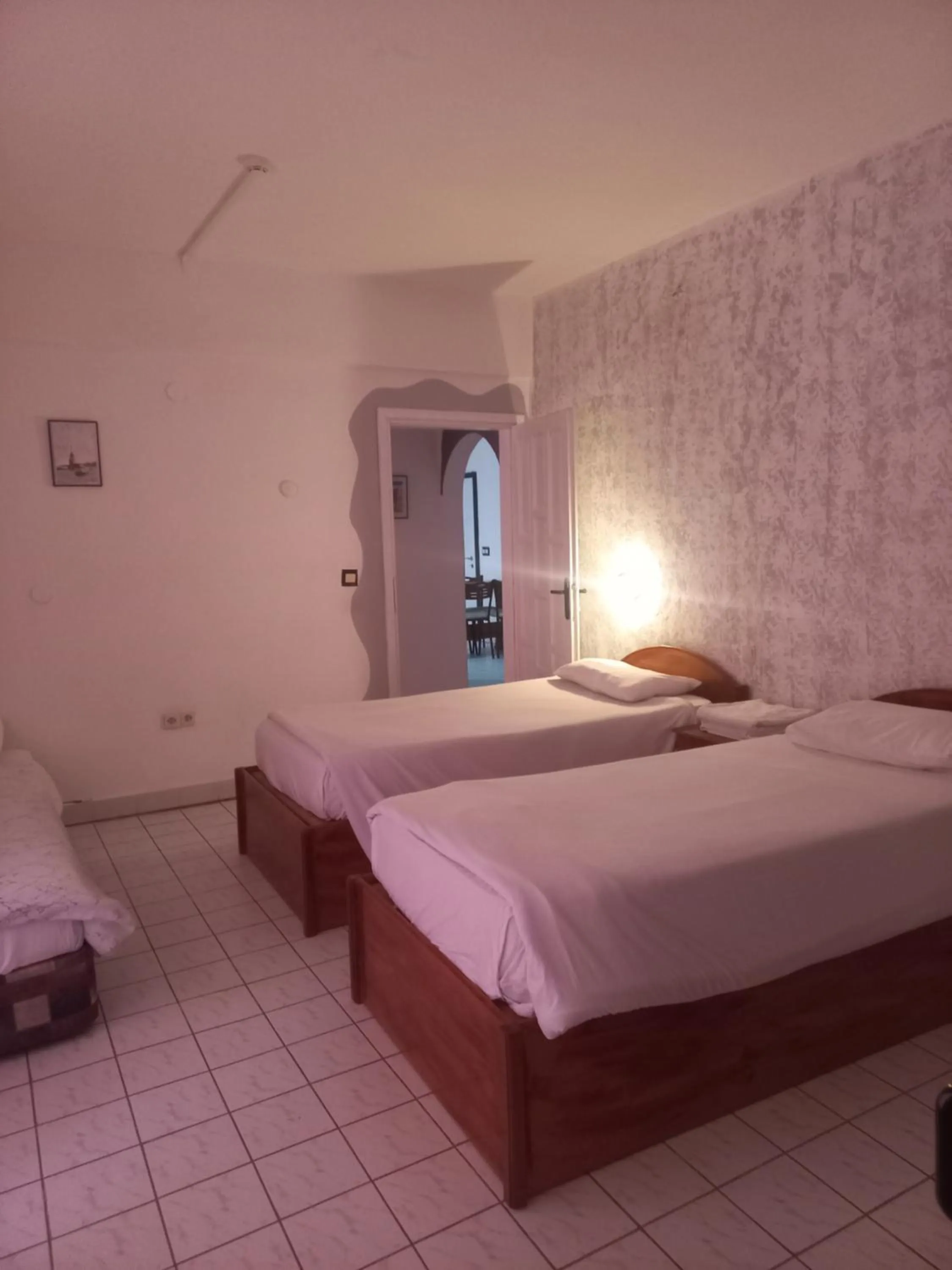 Bed in Delphin Apart Hotel