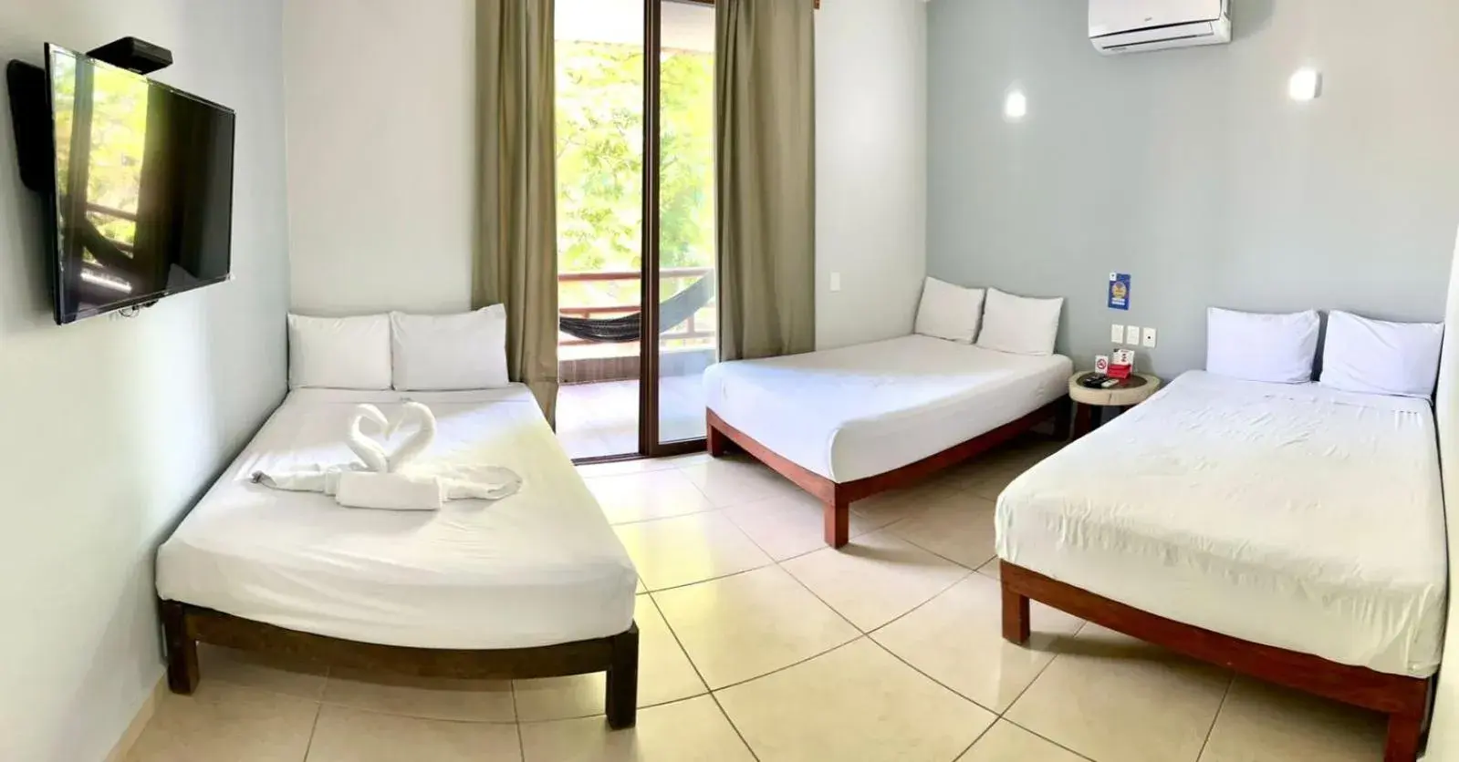 Economy Triple Room in Hotel Aldea Sol Economy Triple Room in Hotel Aldea Sol