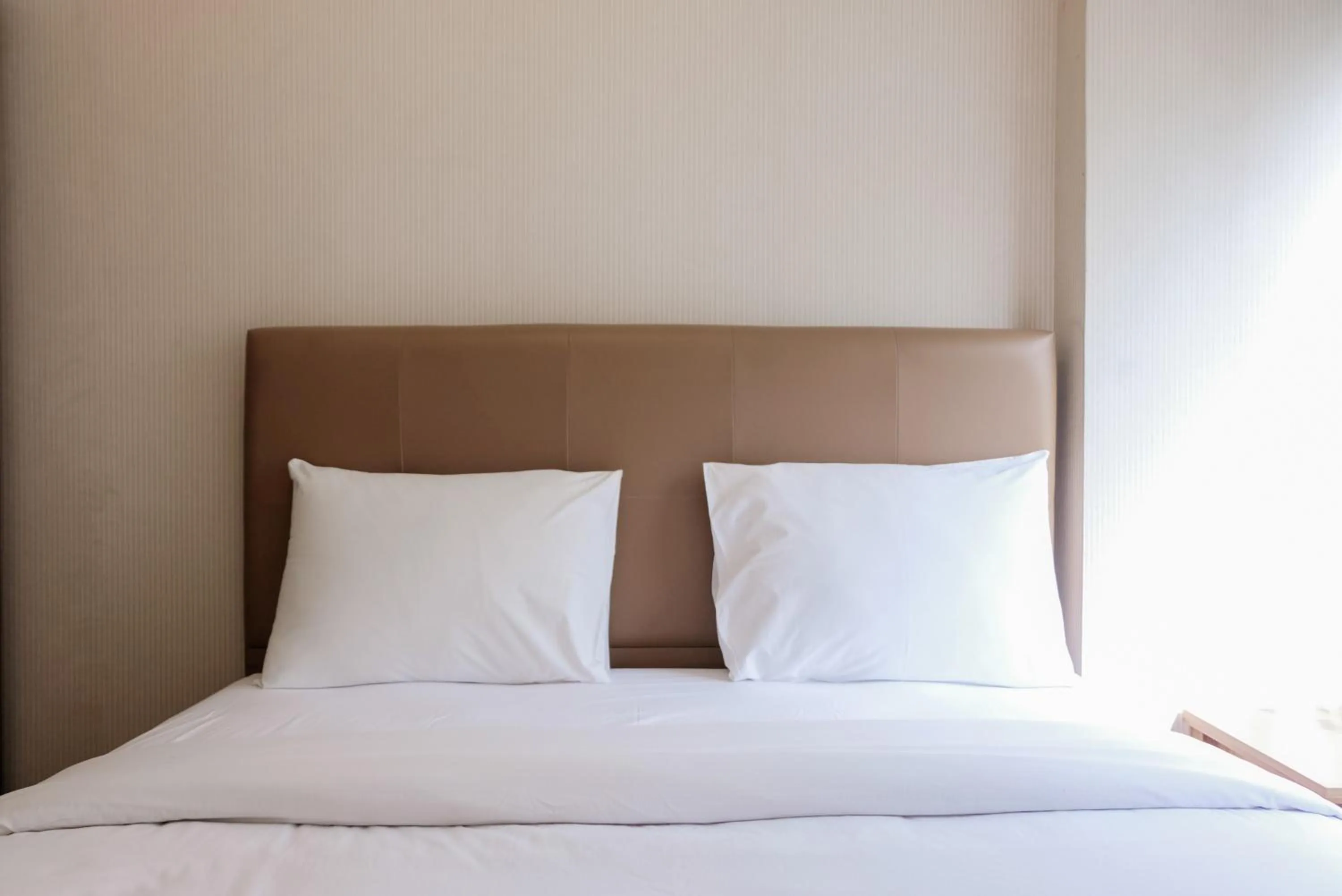 Bed in Luxurious and Convenient 2BR 19 Avenue Apartment By Travelio