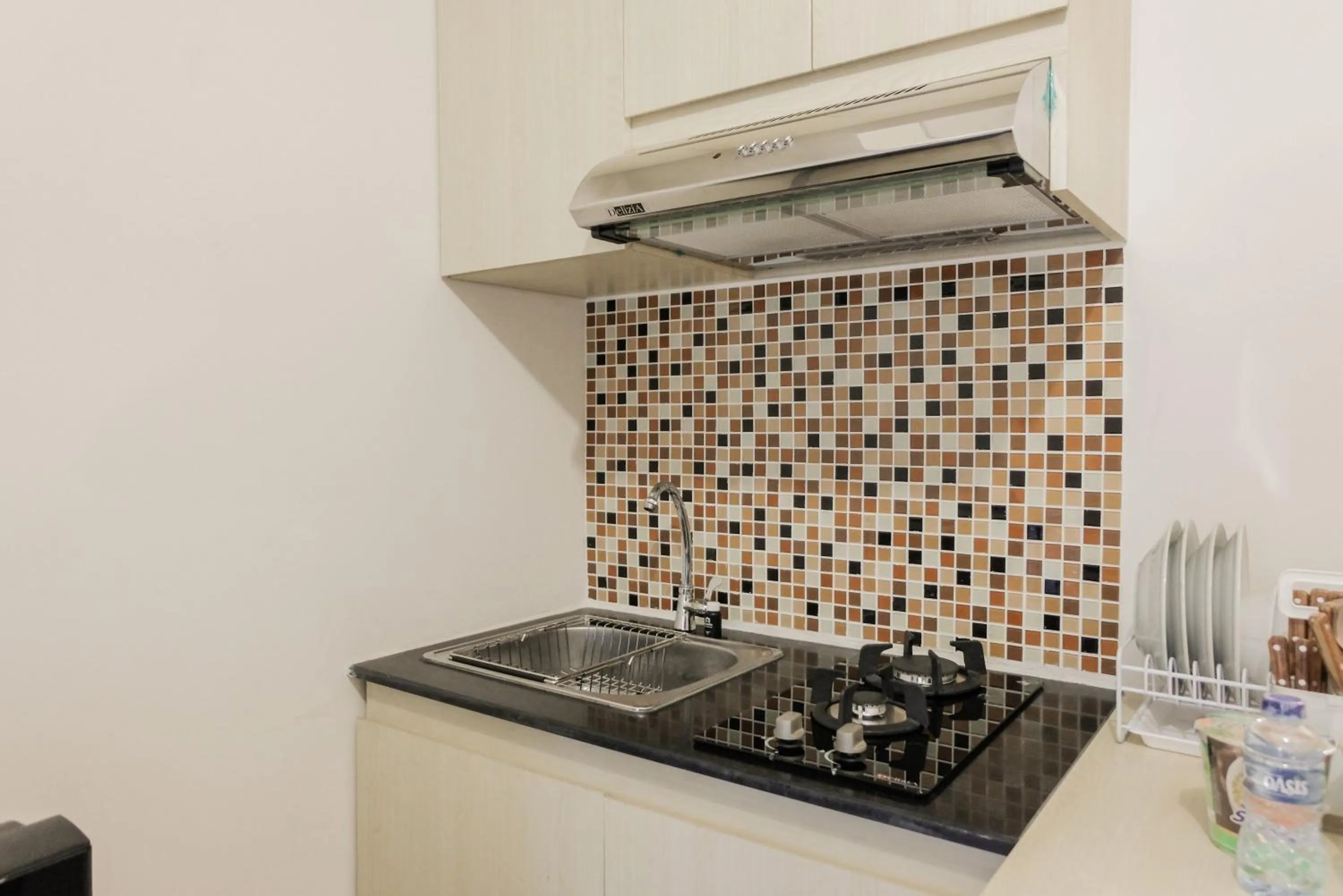 Kitchen or kitchenette in Luxurious and Convenient 2BR 19 Avenue Apartment By Travelio