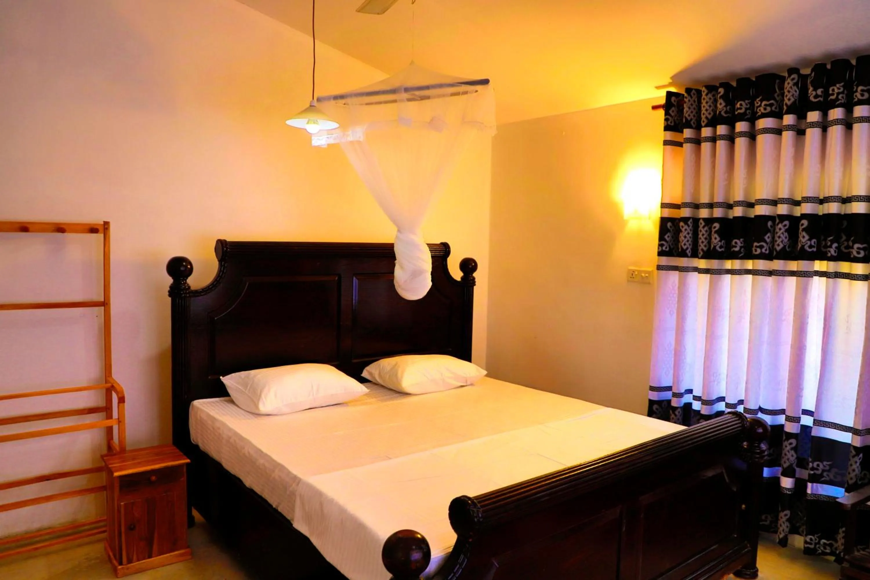 Bed in Hiriketiya Orchid Villa