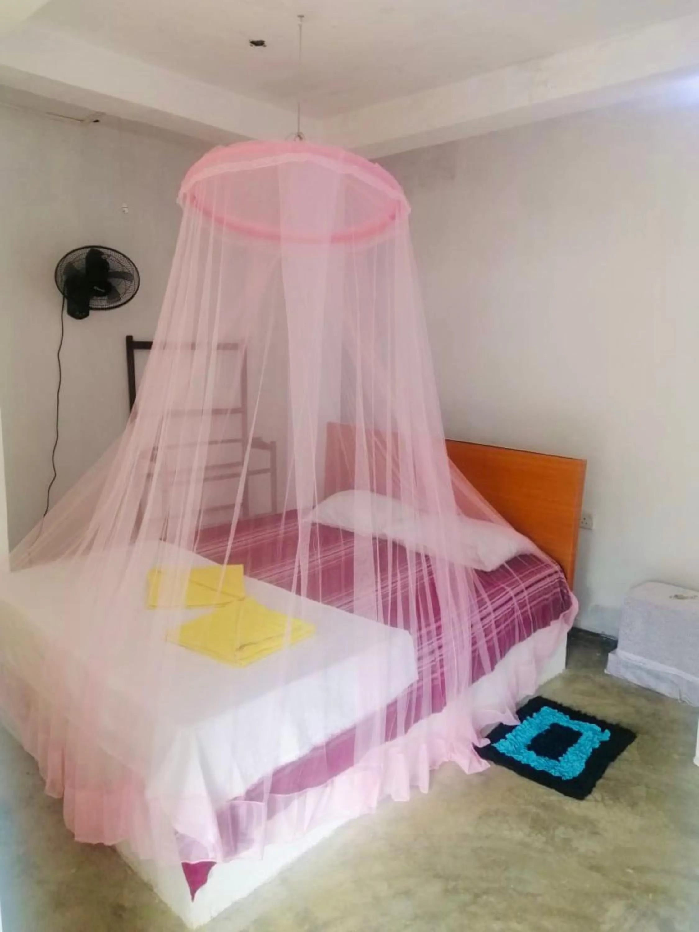 Bed in Hiriketiya Orchid Villa