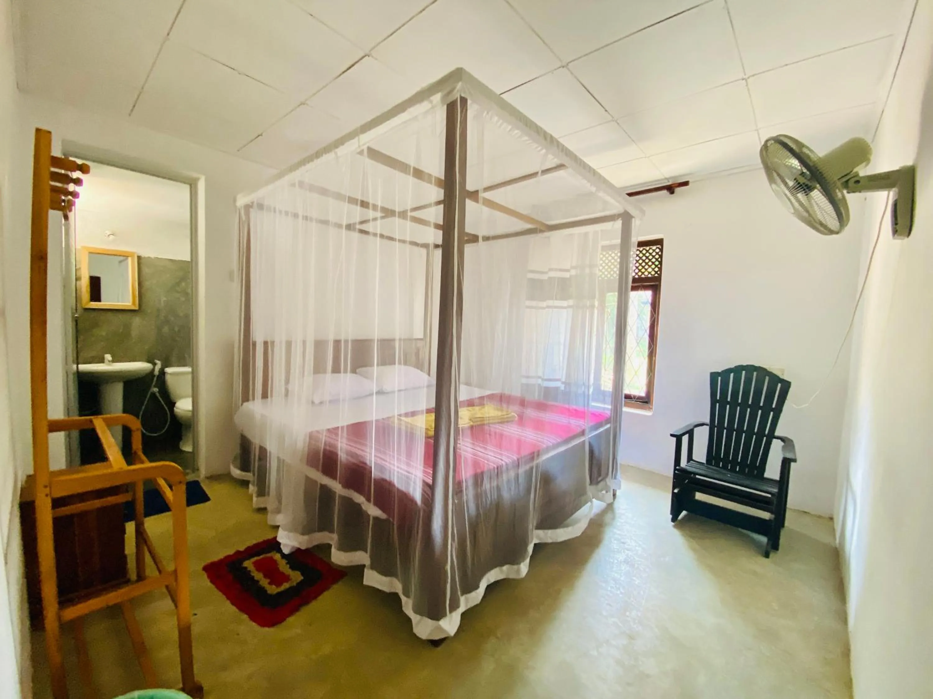 Bed in Hiriketiya Orchid Villa