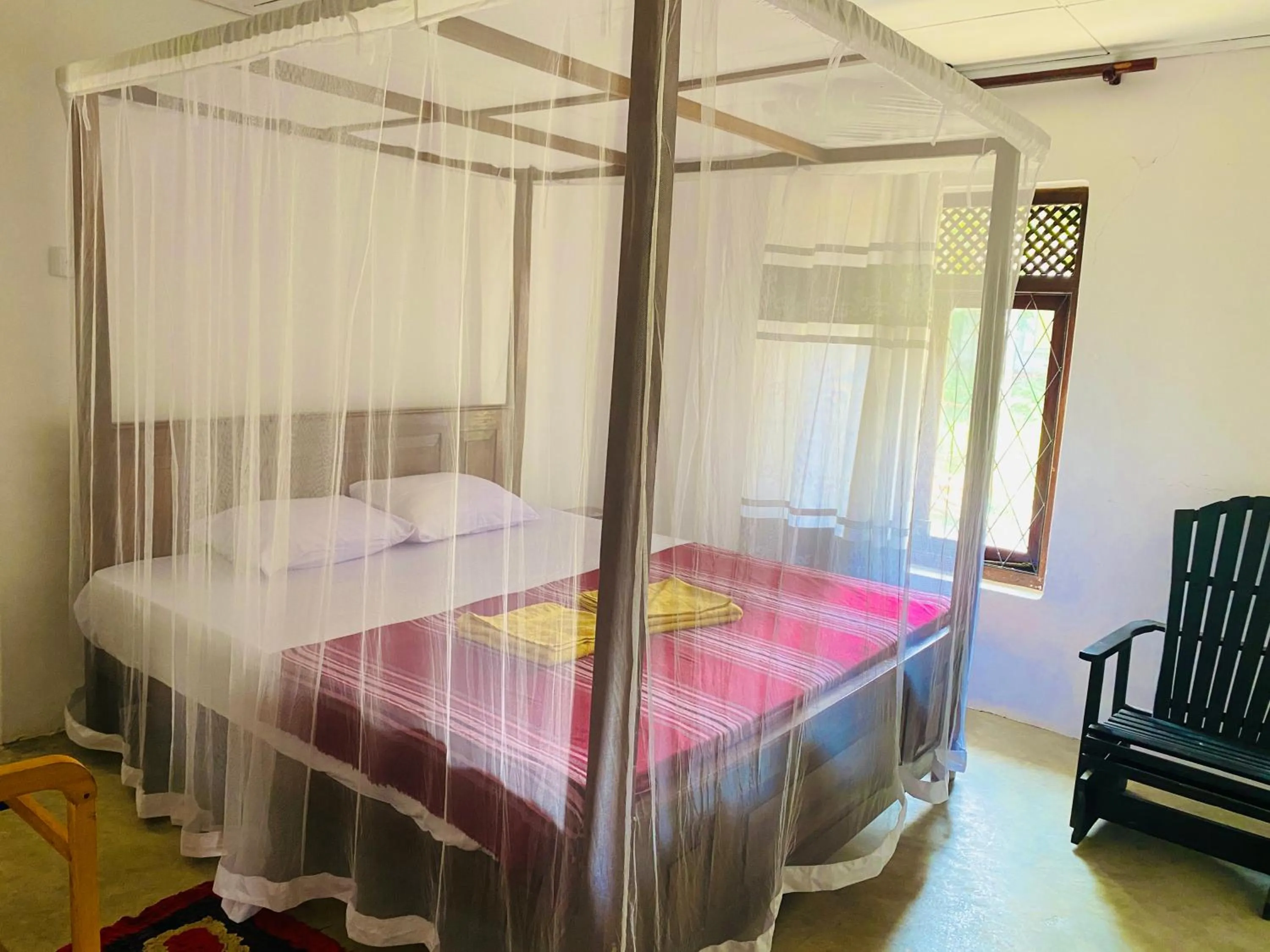 Bed in Hiriketiya Orchid Villa