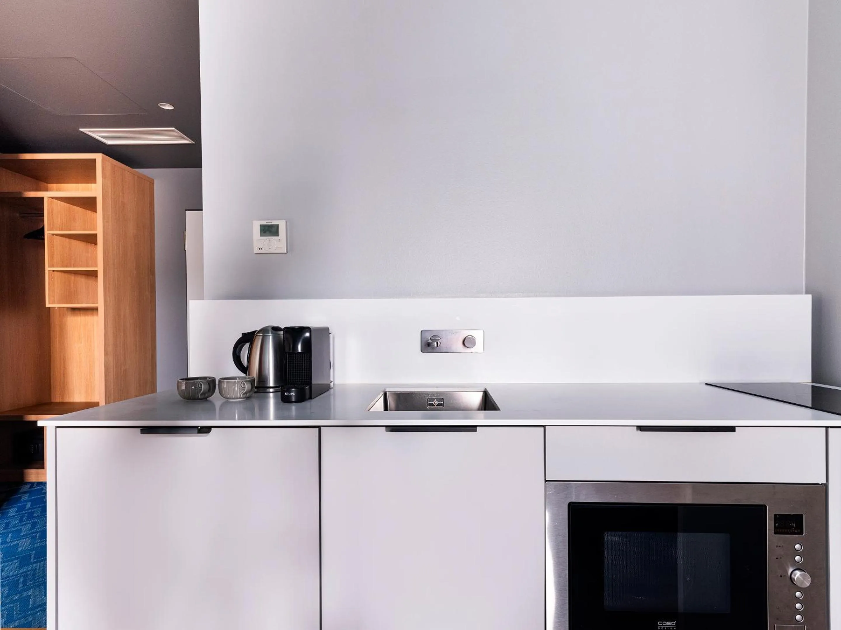 Kitchen or kitchenette in about:berlin Hotel