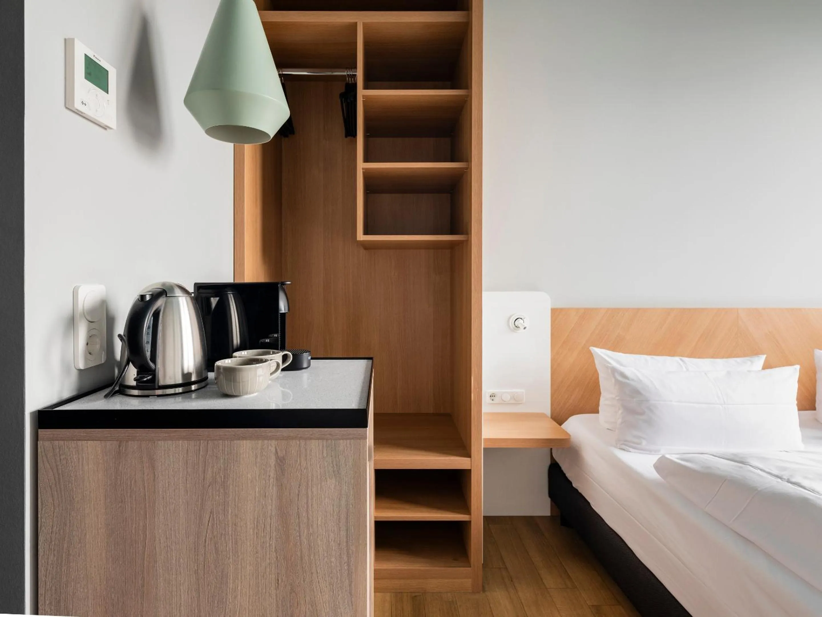 Coffee/tea facilities, Bed in about:berlin Hotel