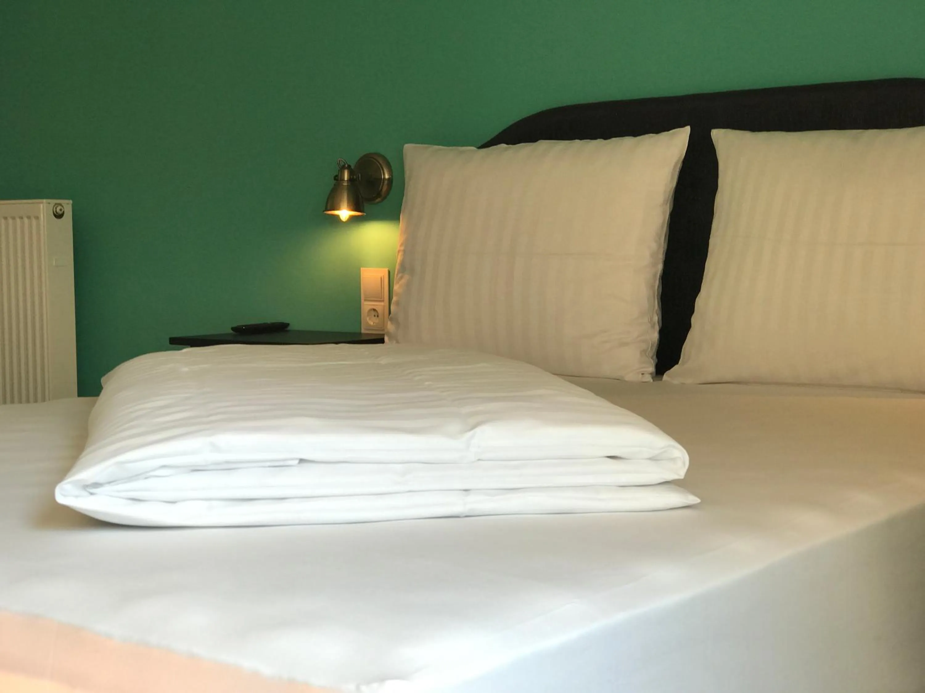 Bed in SmartHotel Mystique Self check-in