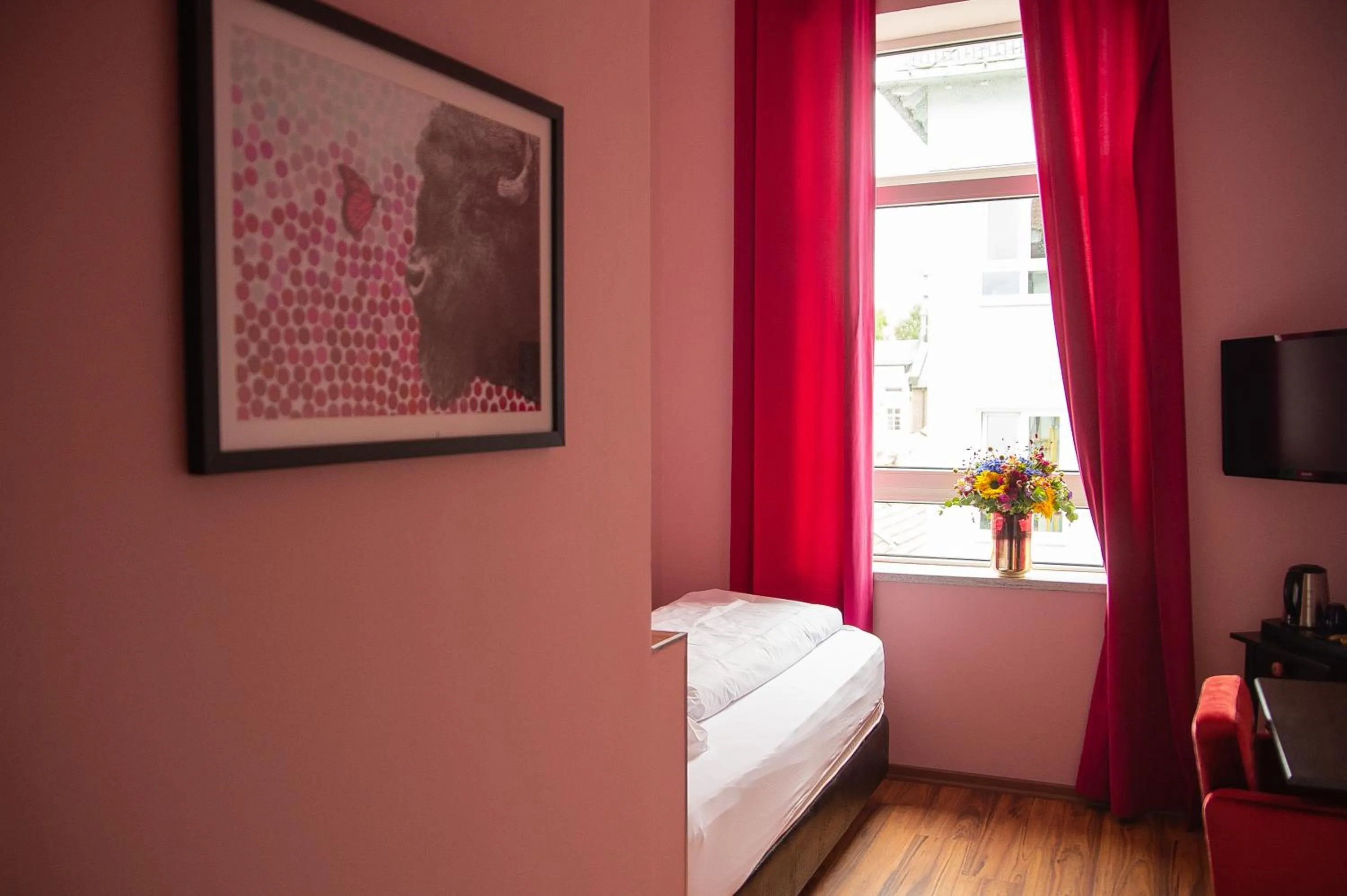 Bed in SmartHotel Mystique Self check-in