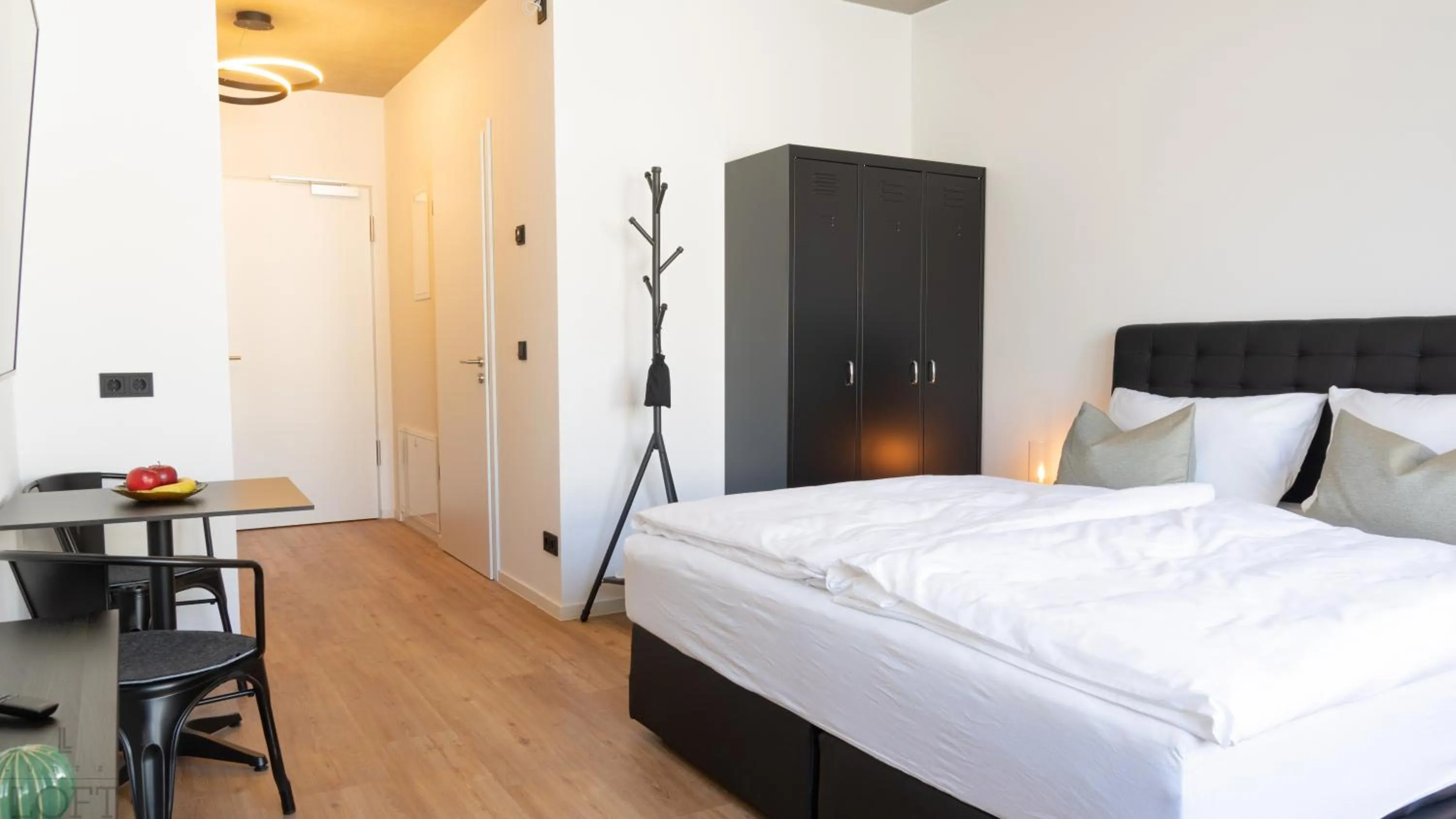 Bed in LÜTTES LOFT Boutique Hotel