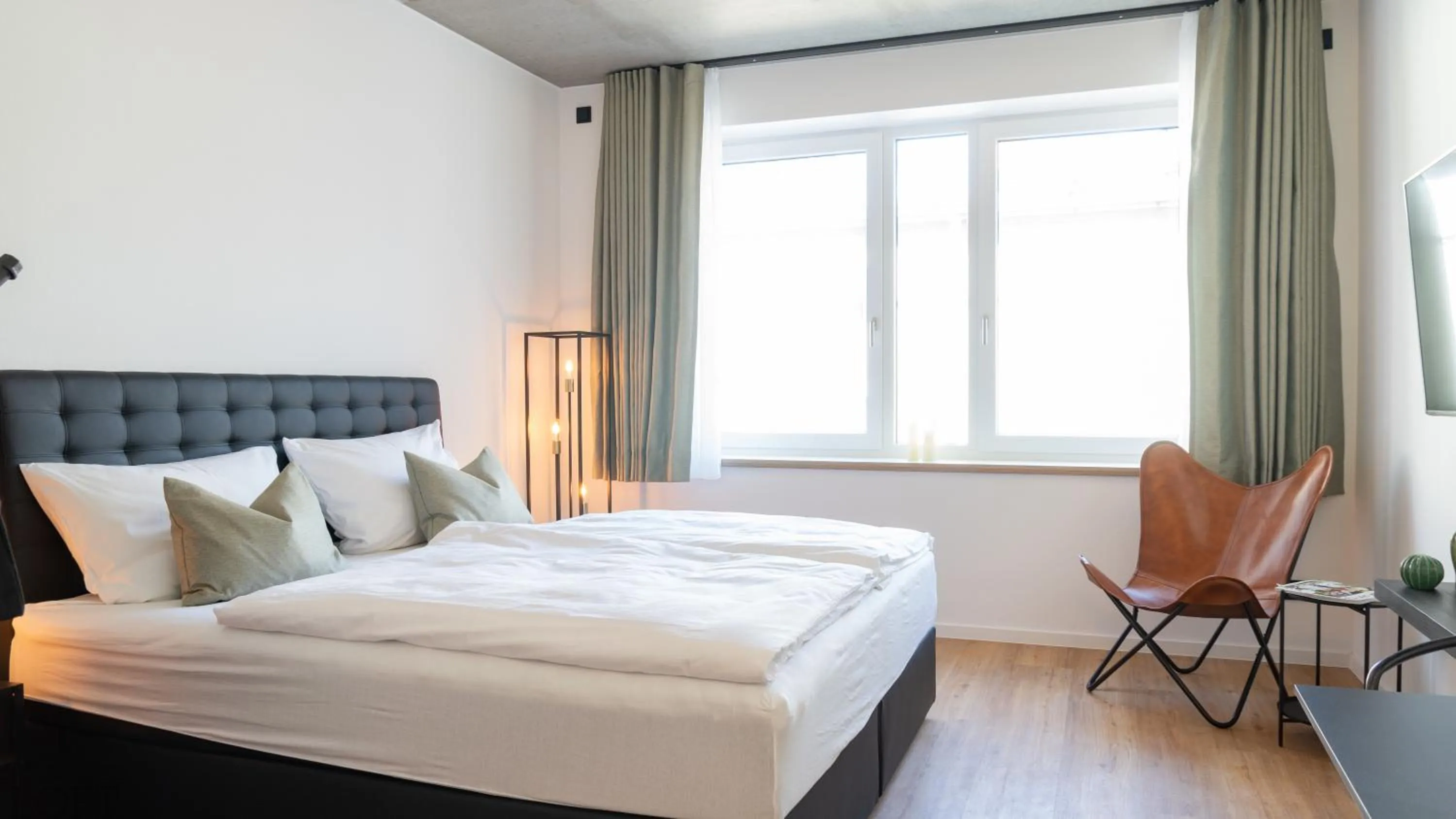 Bed in LÜTTES LOFT Boutique Hotel