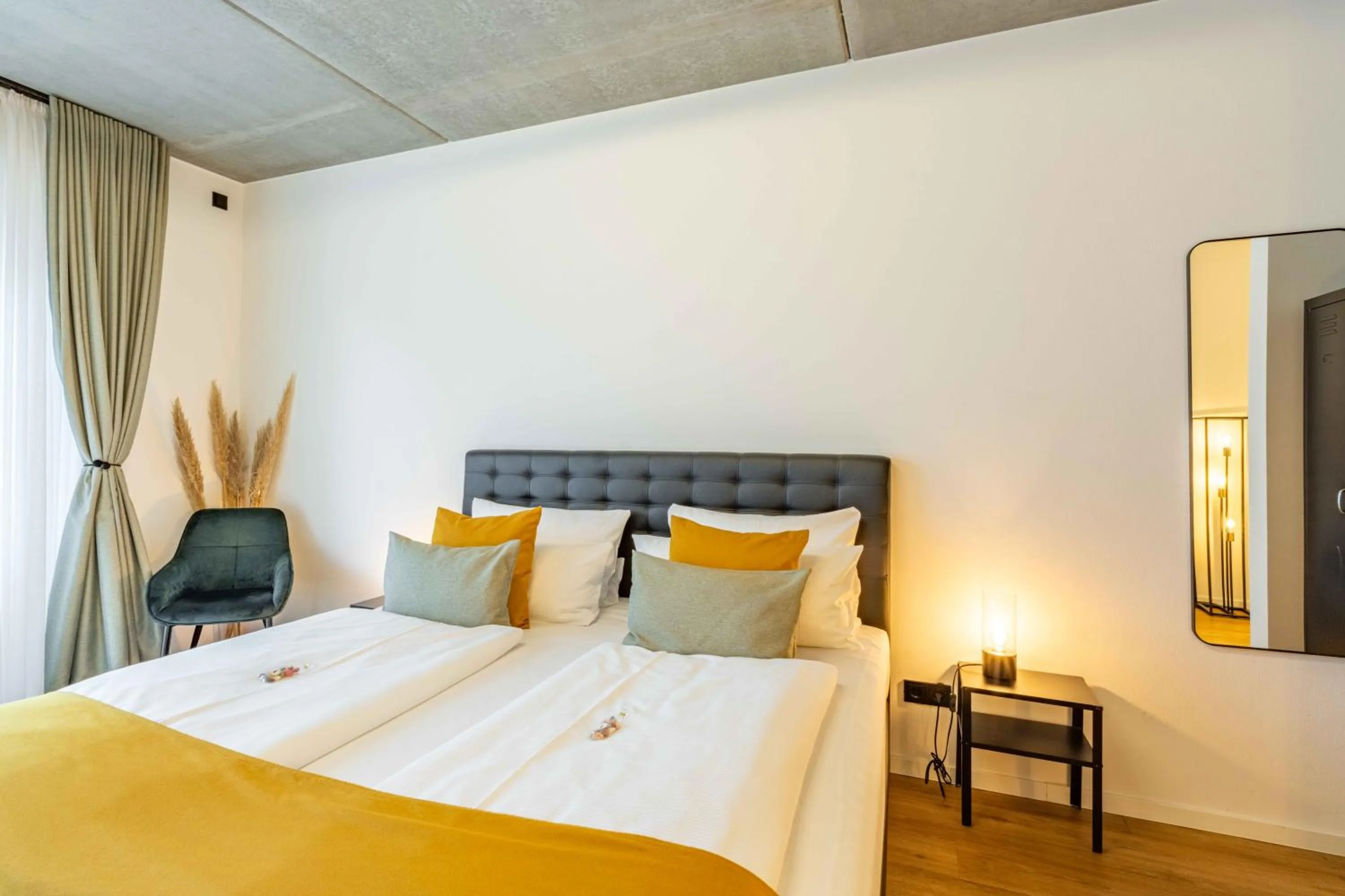 Bed in LÜTTES LOFT Boutique Hotel