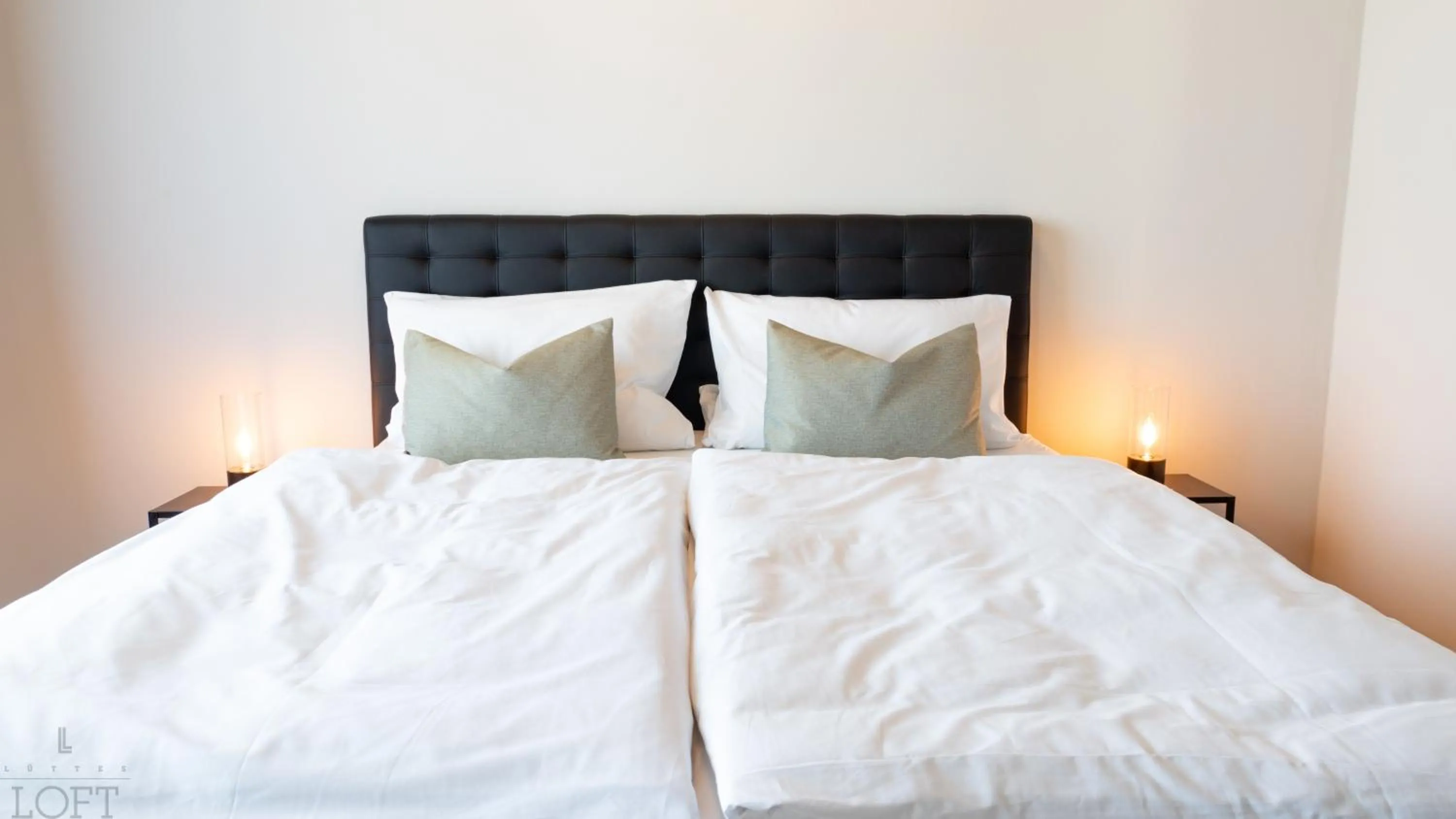 Bed in LÜTTES LOFT Boutique Hotel