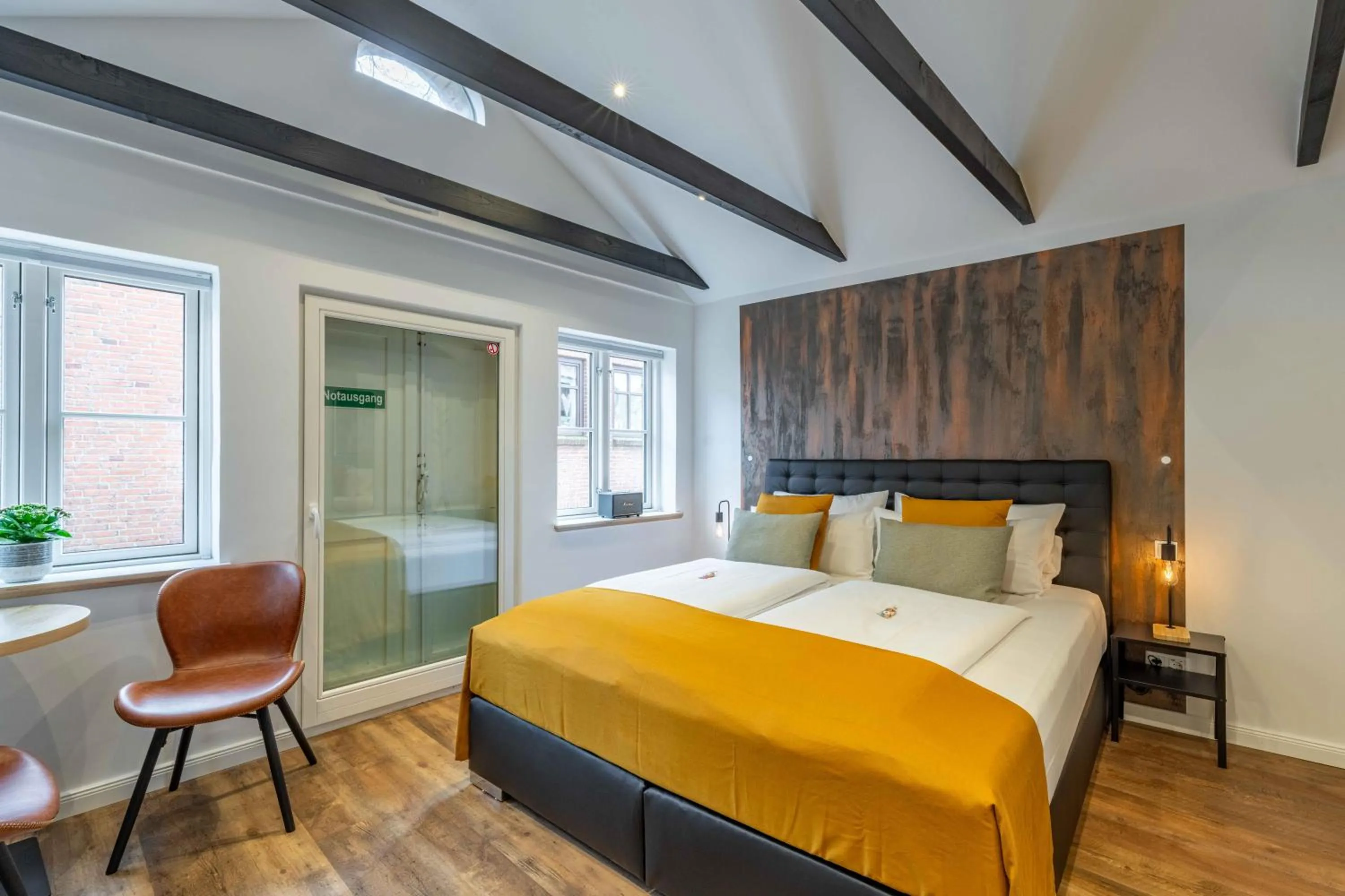 Bed in LÜTTES LOFT Boutique Hotel