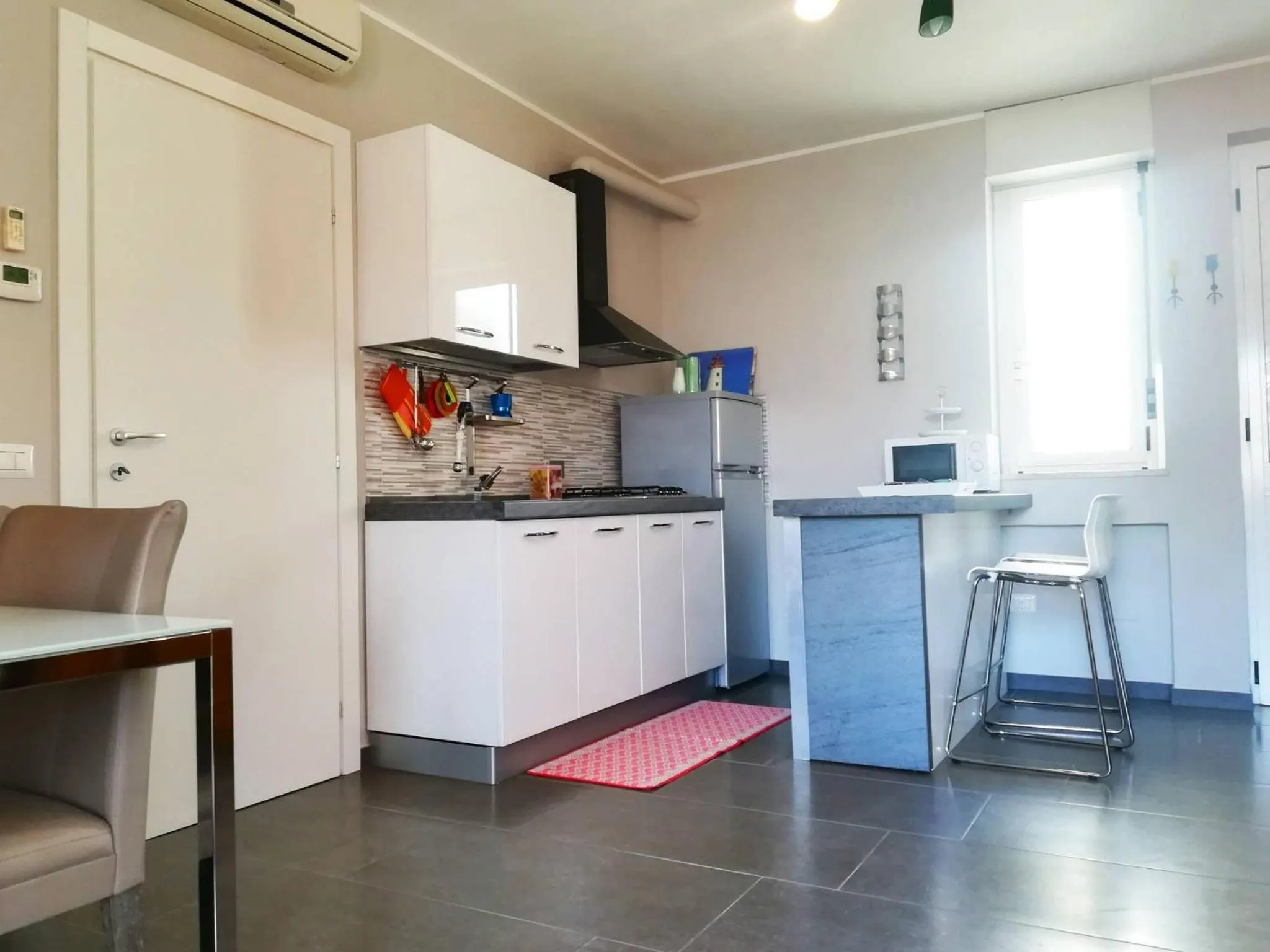 kitchen in Modern Holiday Apartment With Wi-fi, Air Conditioning And Balcony; Pets Allowed