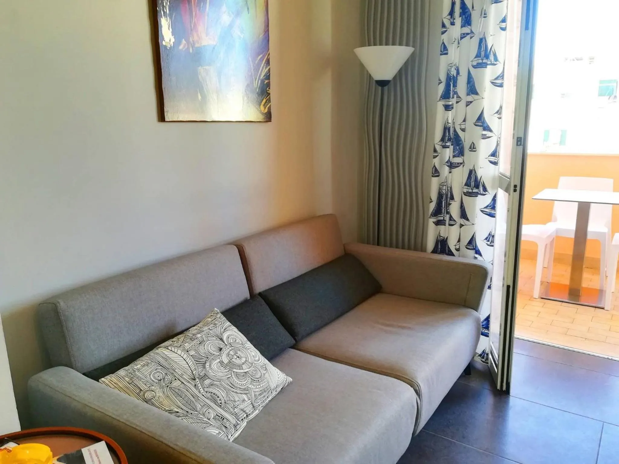 Seating area in Modern Holiday Apartment With Wi-fi, Air Conditioning And Balcony; Pets Allowed