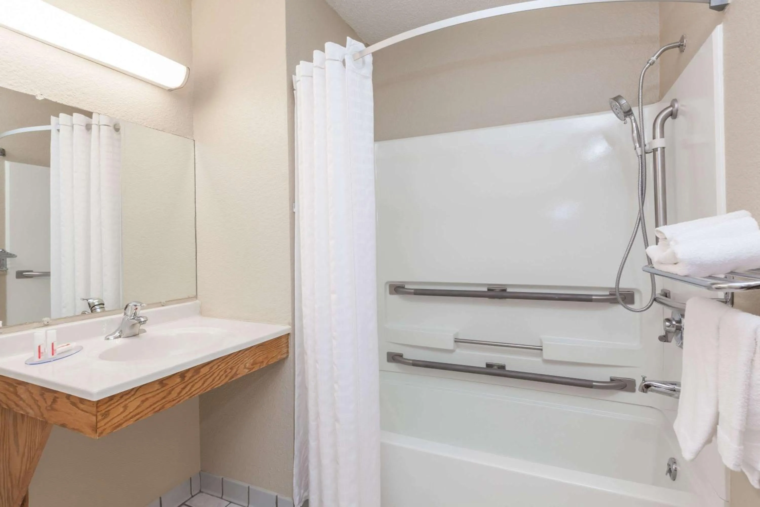 Bathroom in Super 8 by Wyndham Dunbar/Charleston Area