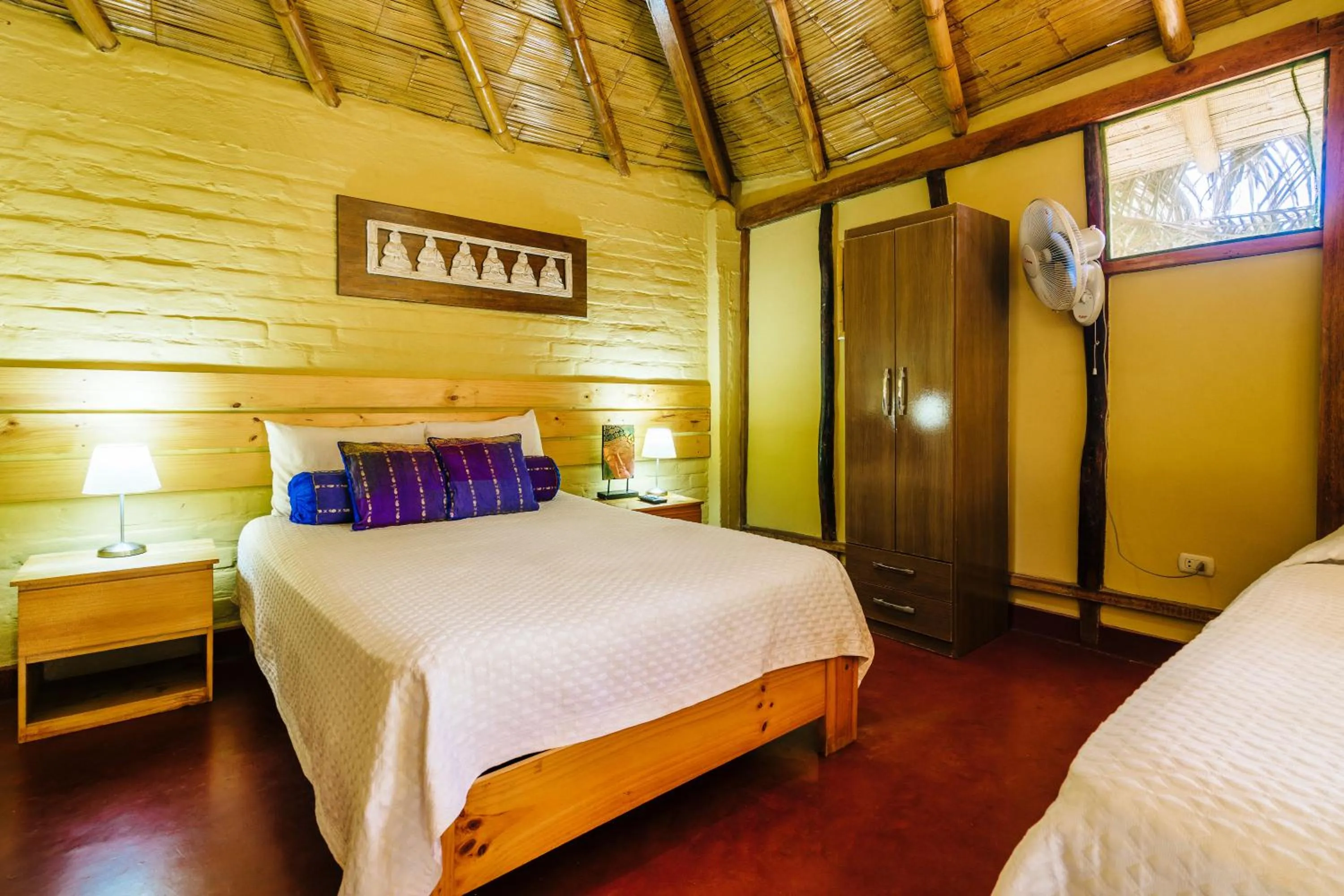 Bed in Kimbas Bungalows Mancora