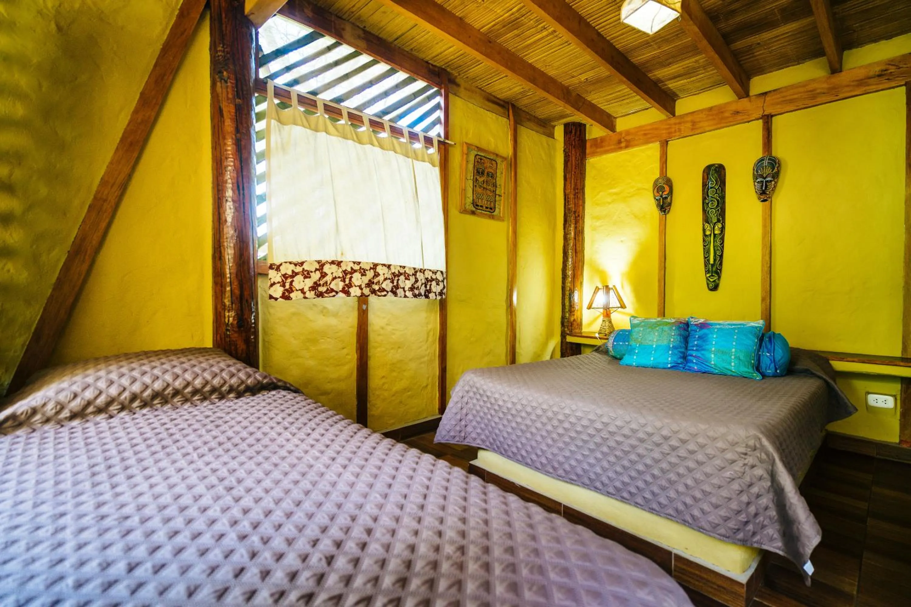 Bed in Kimbas Bungalows Mancora