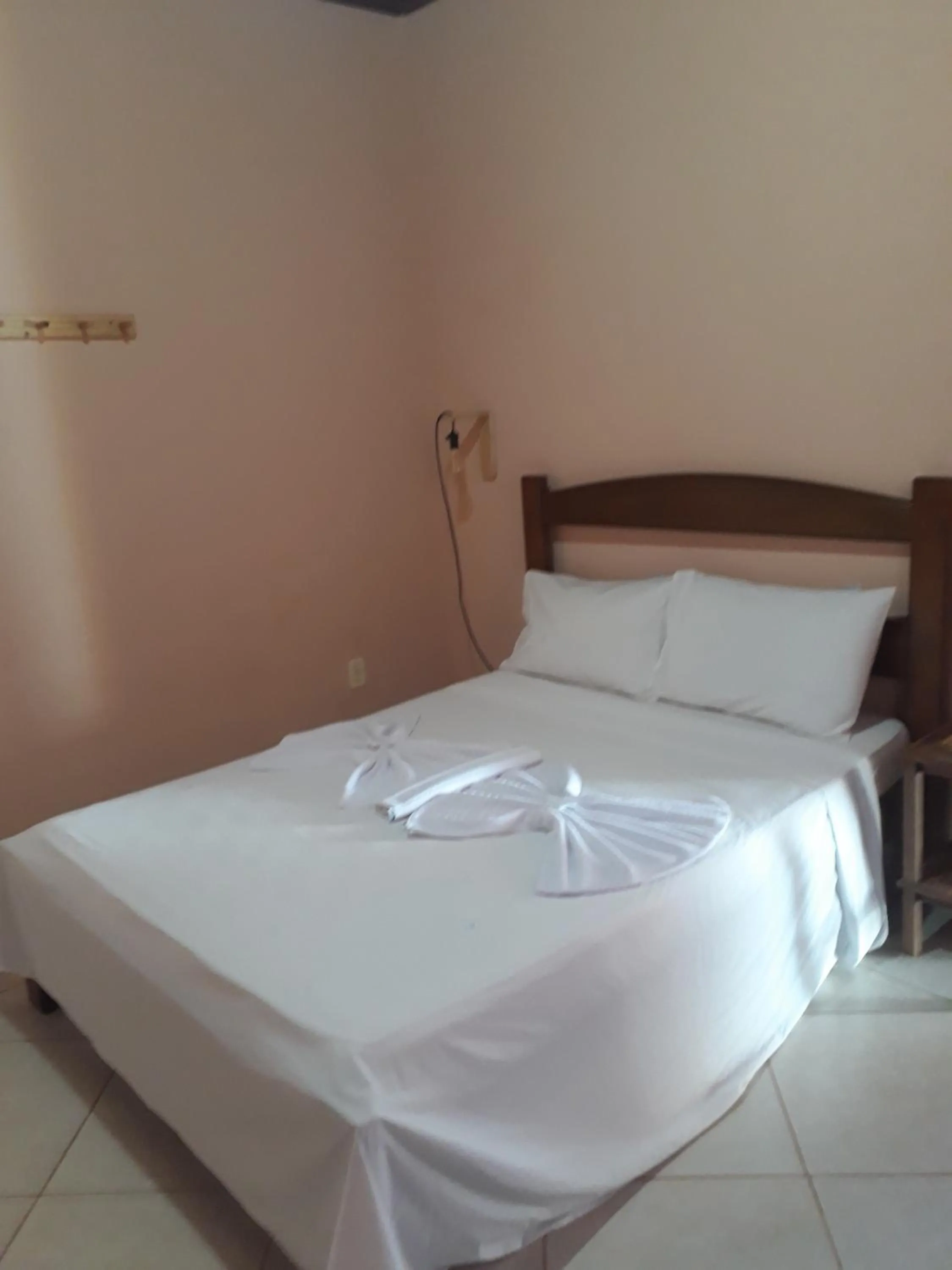 Bed in Pousada Licuri