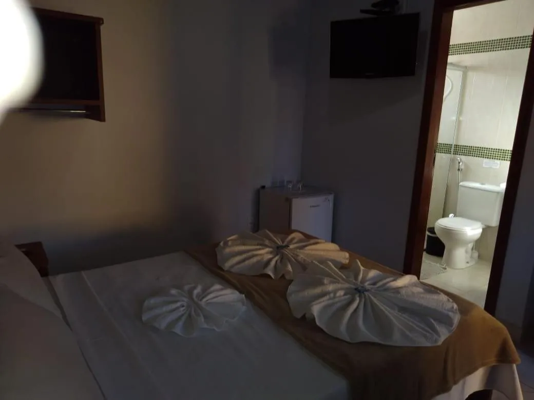 Bed in Pousada Licuri
