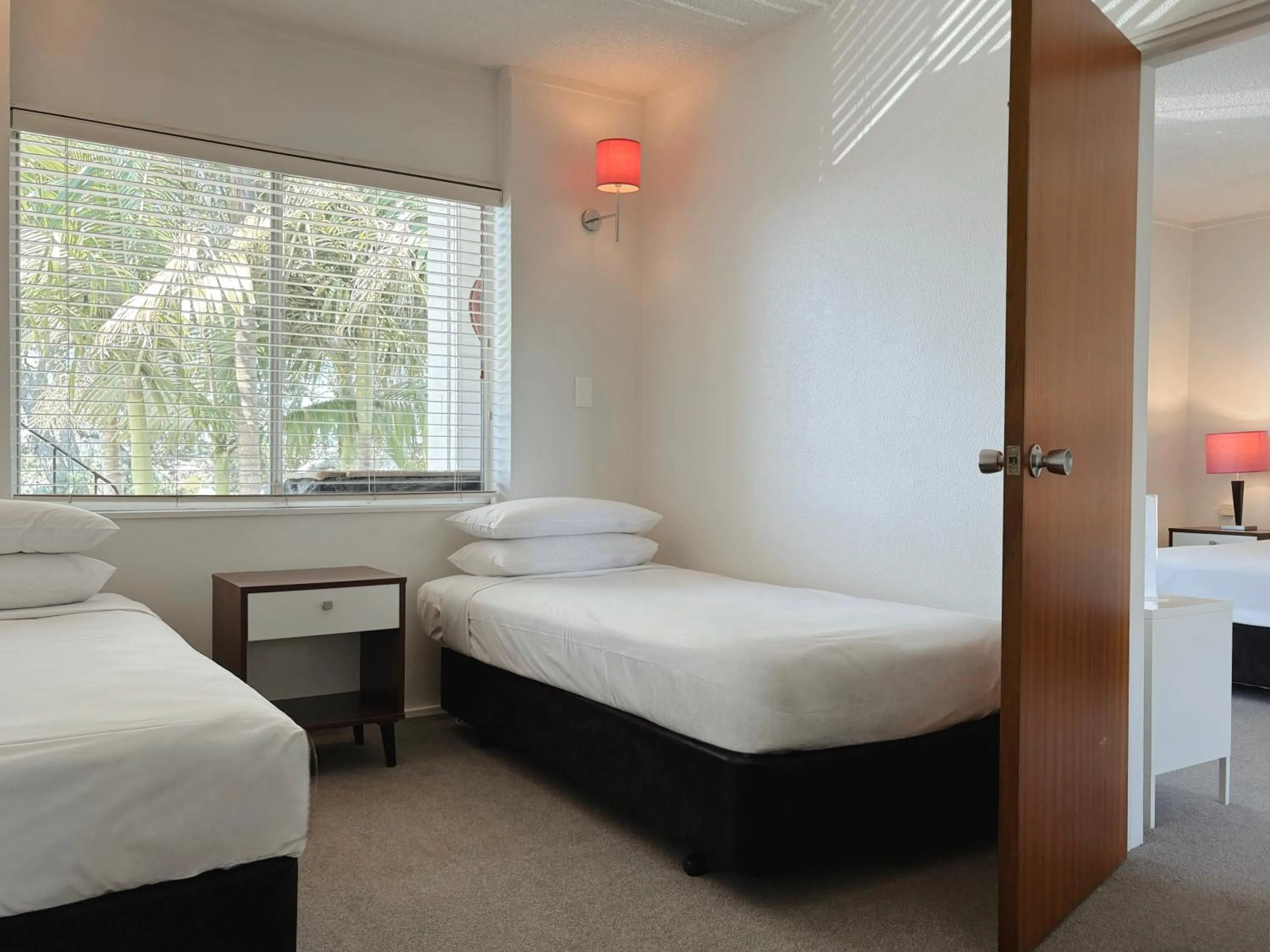 Bed in Mt Albert Motor Lodge