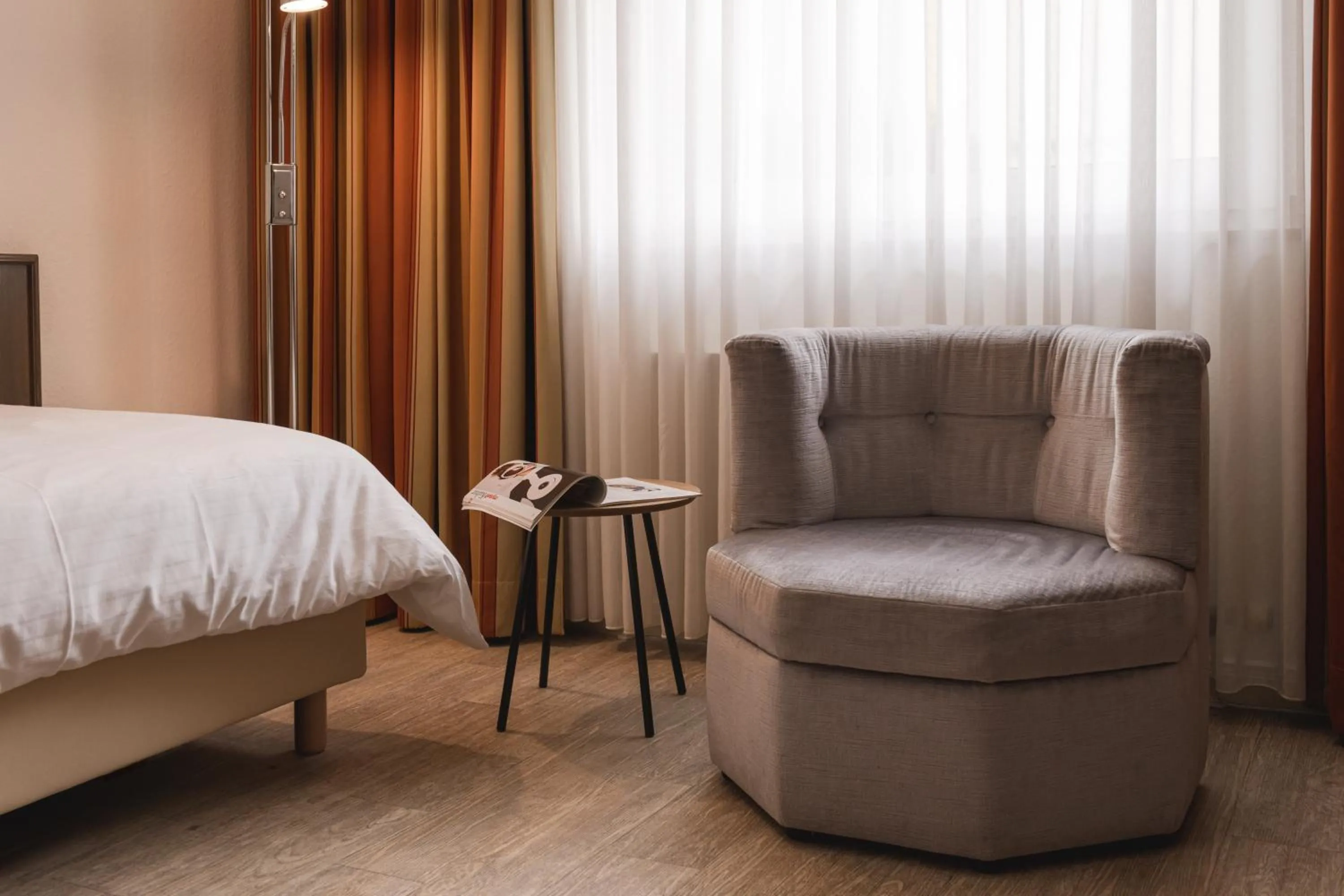 Seating area, Bed in Hotel Astra