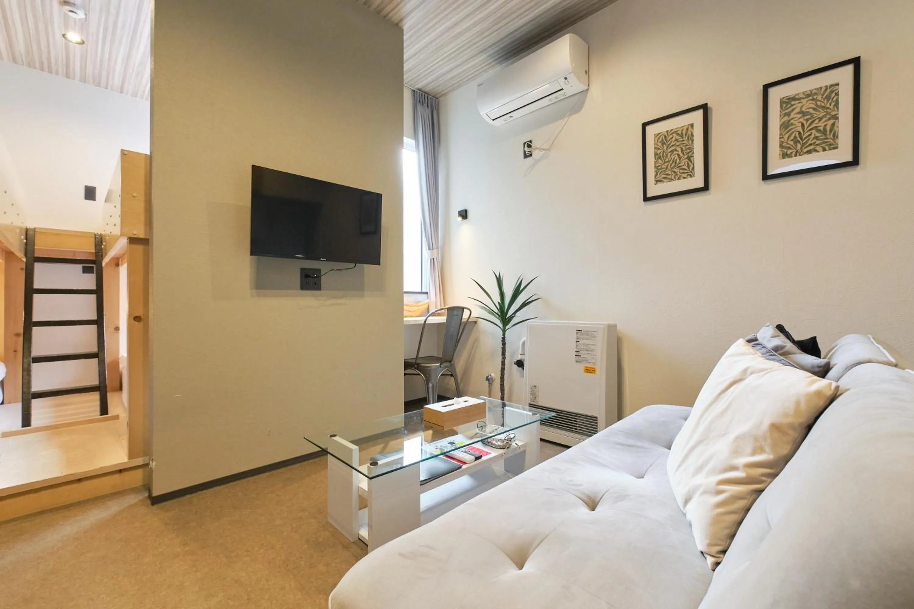 Living room in UCHI SUSUKINO WEST by Hotel Wheat