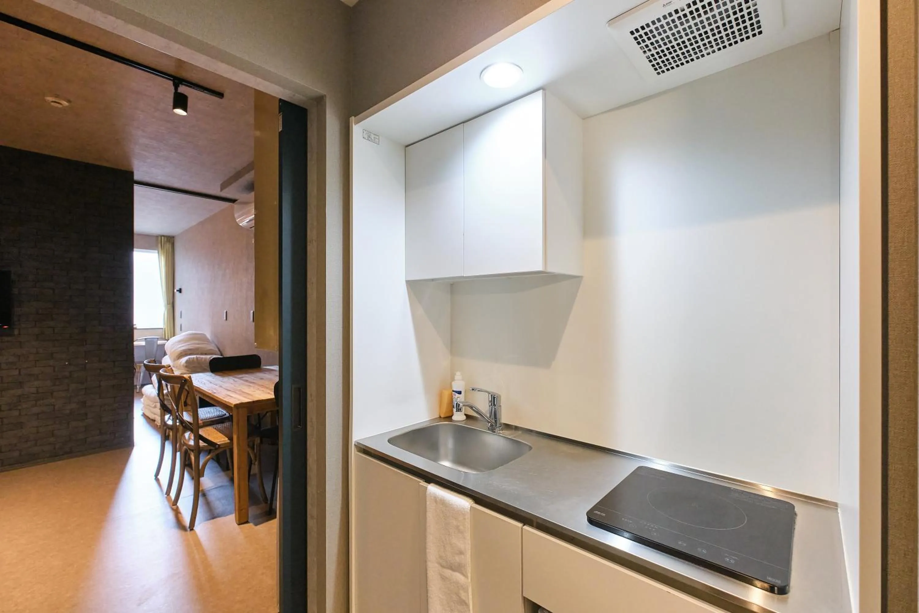 kitchen in UCHI SUSUKINO WEST by Hotel Wheat