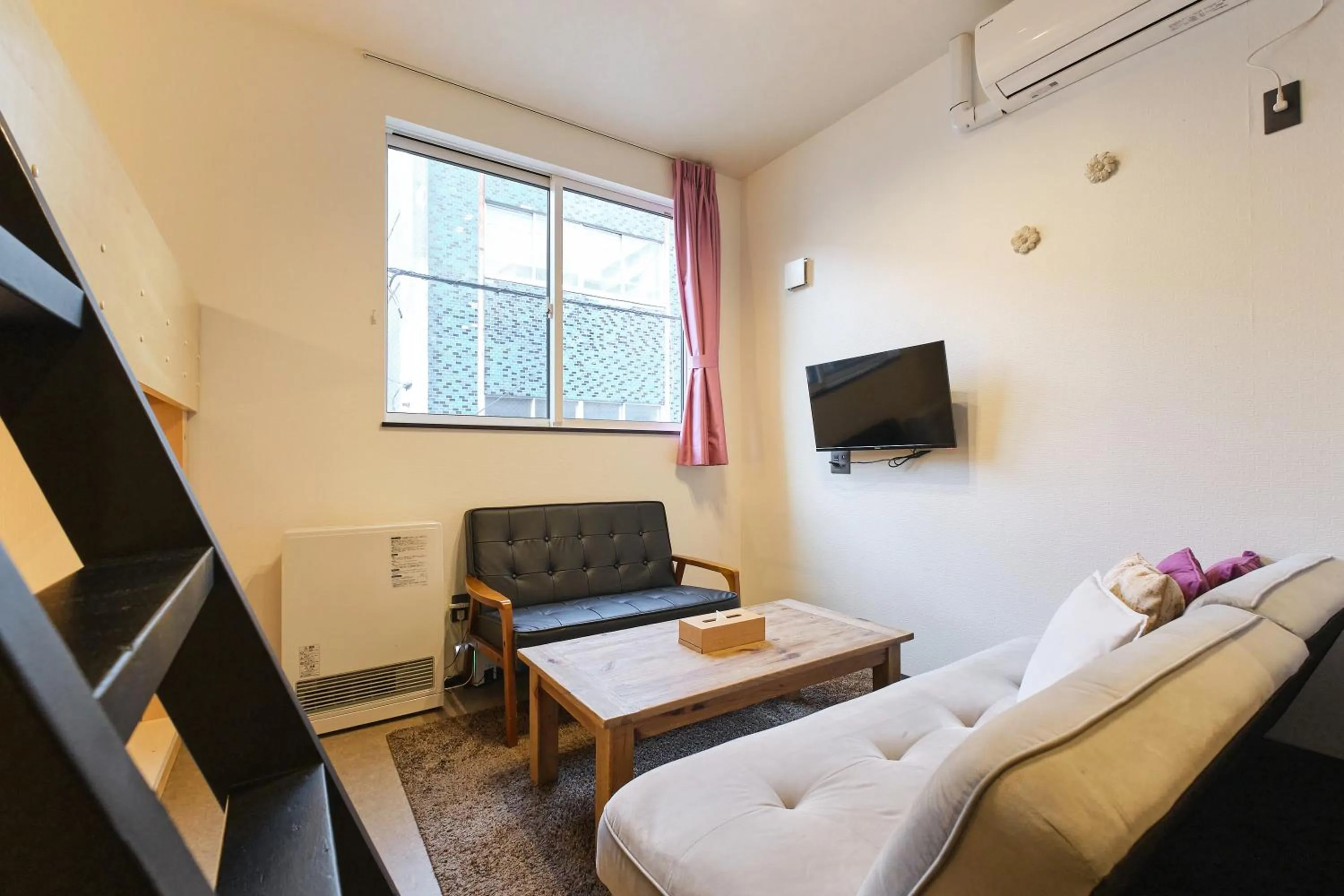 Living room in UCHI SUSUKINO WEST by Hotel Wheat