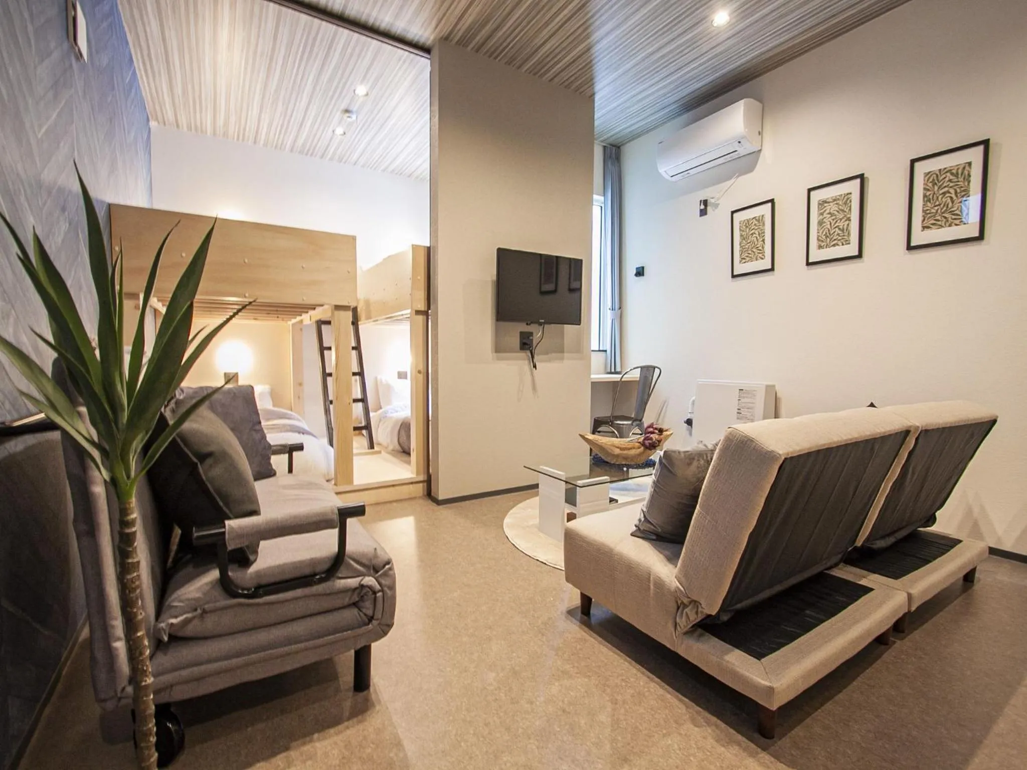 Living room in UCHI SUSUKINO WEST by Hotel Wheat