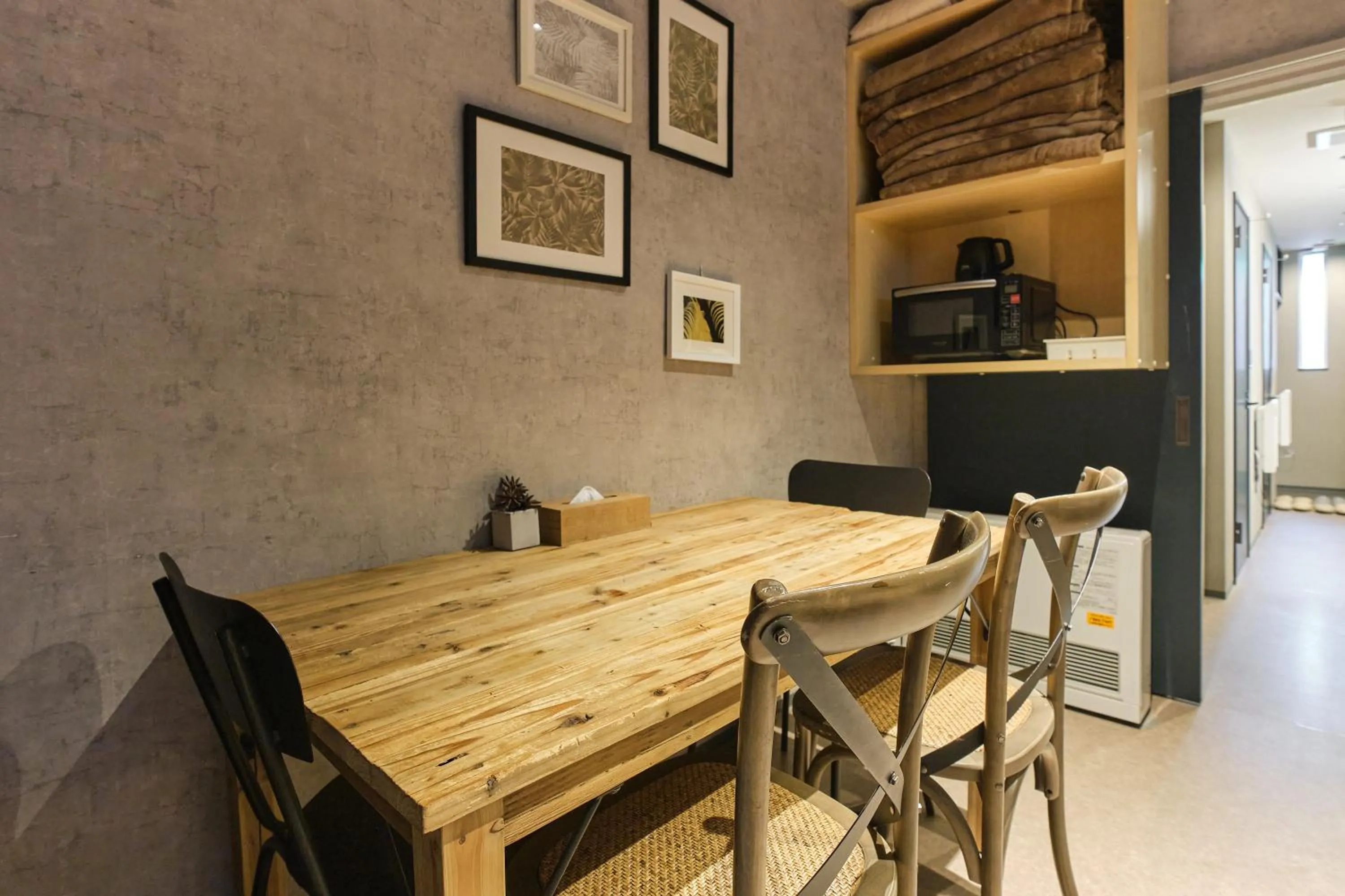 Dining area in UCHI SUSUKINO WEST by Hotel Wheat