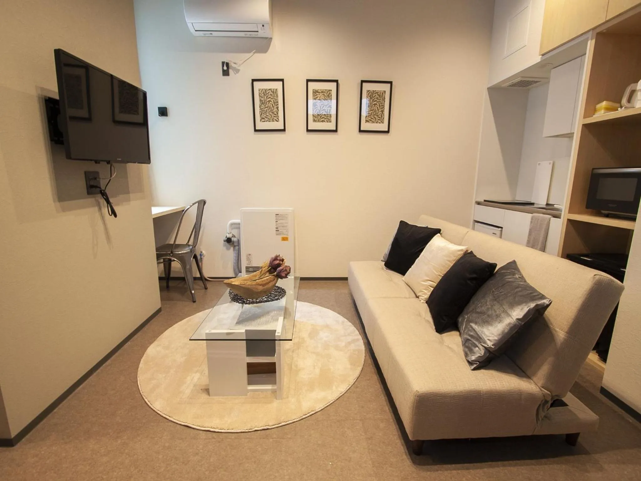 Living room in UCHI SUSUKINO WEST by Hotel Wheat