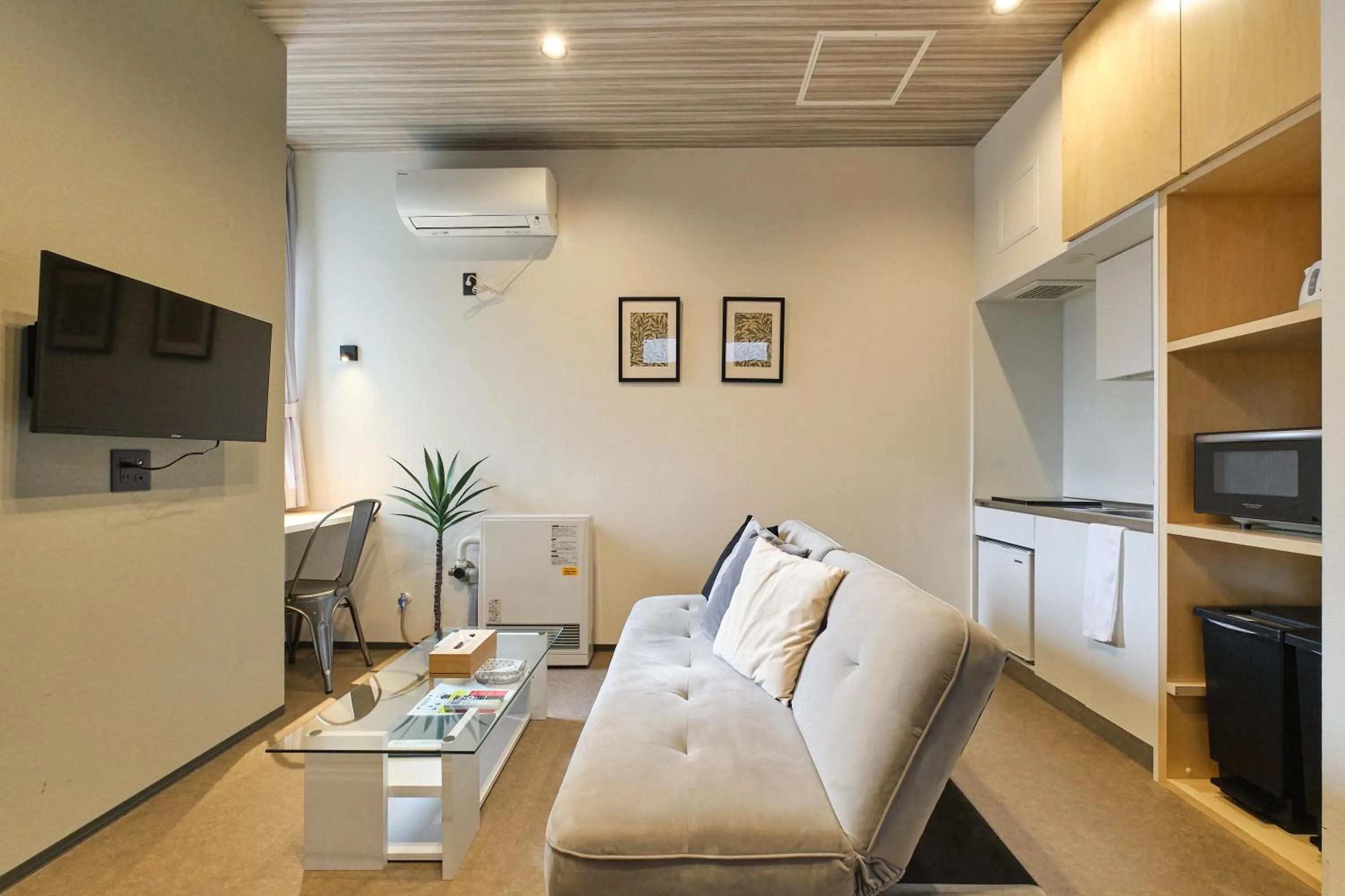 Living room in UCHI SUSUKINO WEST by Hotel Wheat