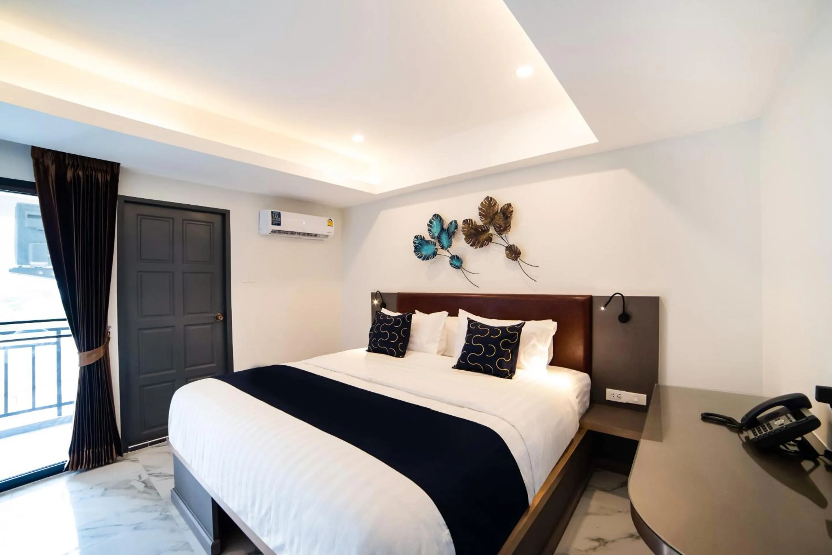 Bed in RoomQuest Sukhumvit36 BTS Thonglor