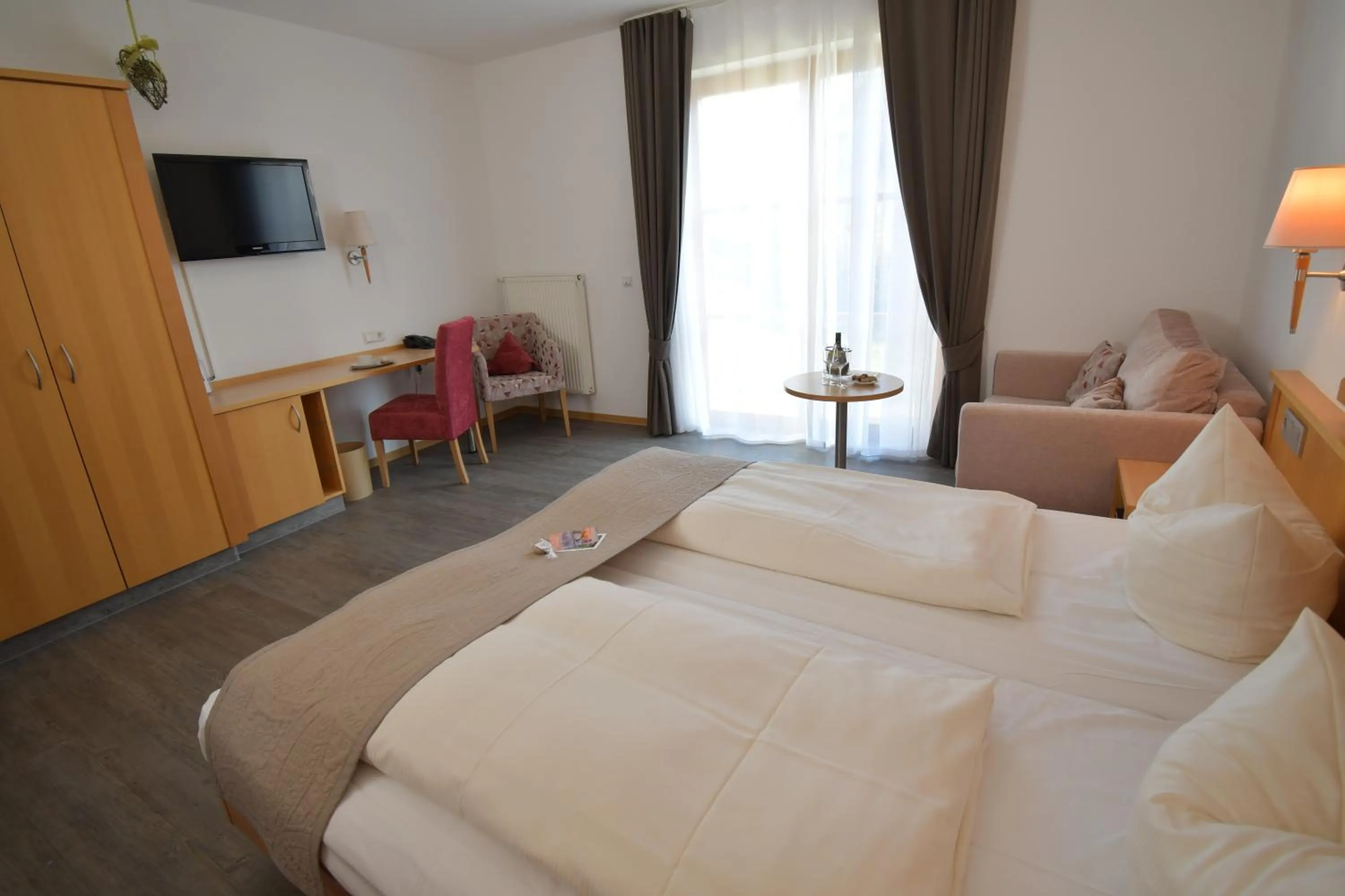 Photo of the whole room, Bed in AKZENT Hotel Franziskaner