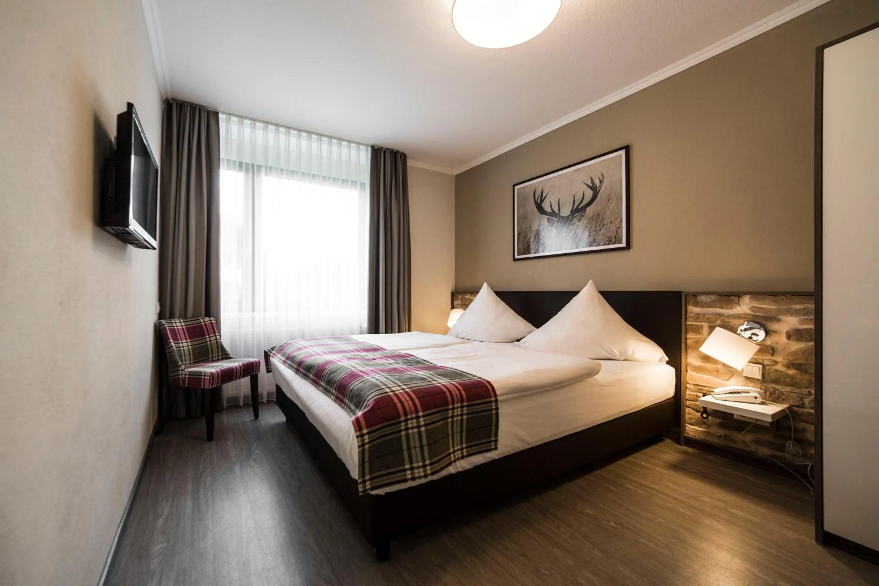 Photo of the whole room, Bed in AKZENT Hotel Thiemann