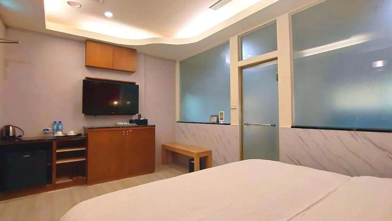 Bed in Jin Yong Quan Spa Hotspring Resort