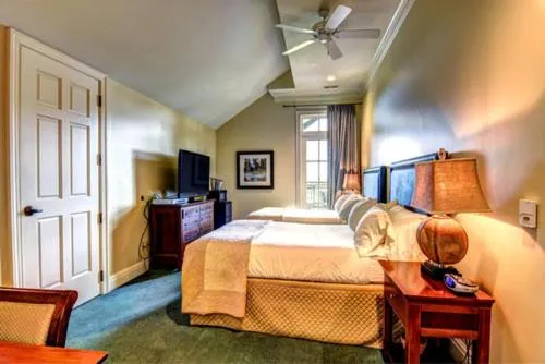 Bed in Cottages and Suites at River Landing