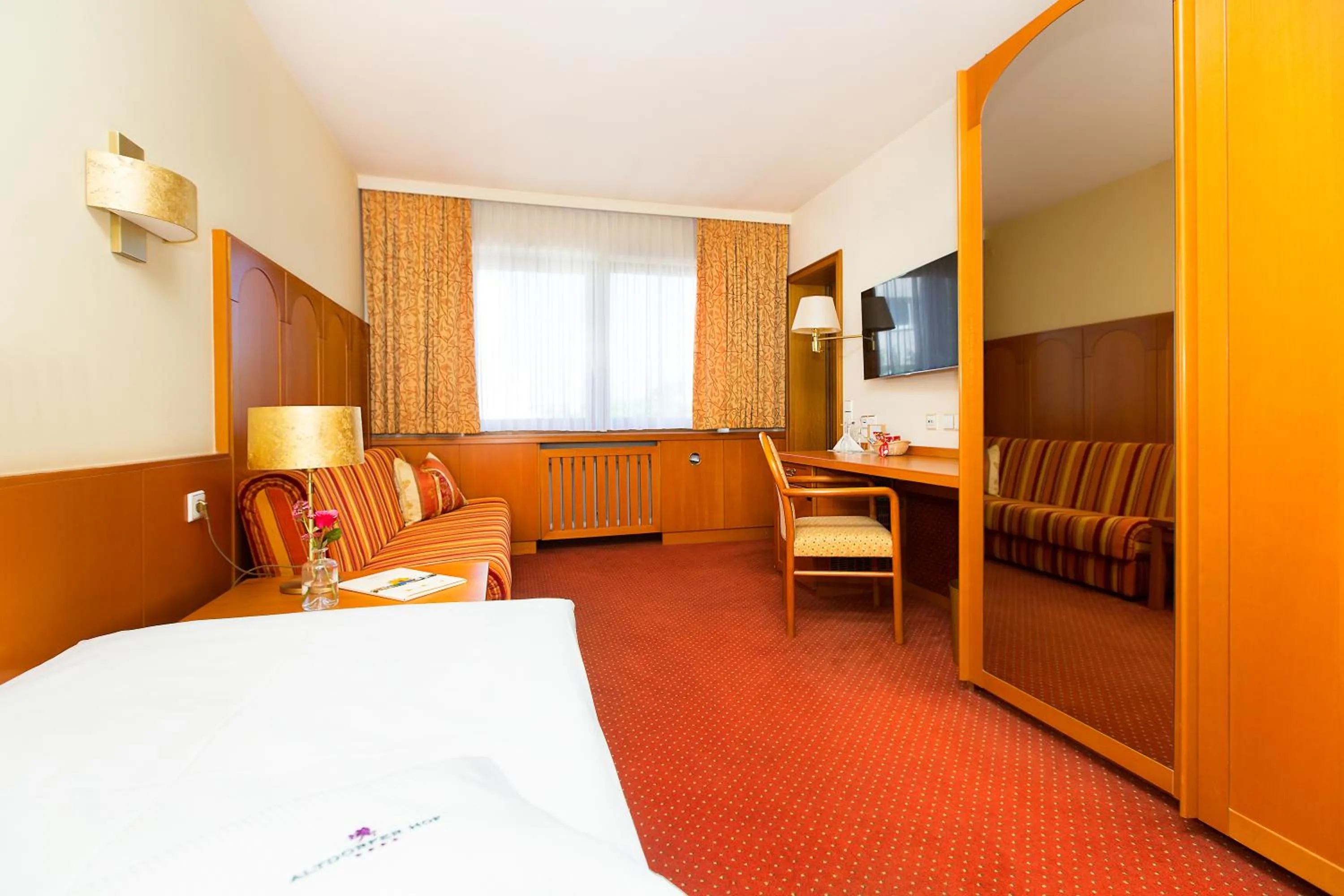 Photo of the whole room, Bed in AKZENT Hotel Restaurant Altdorfer Hof