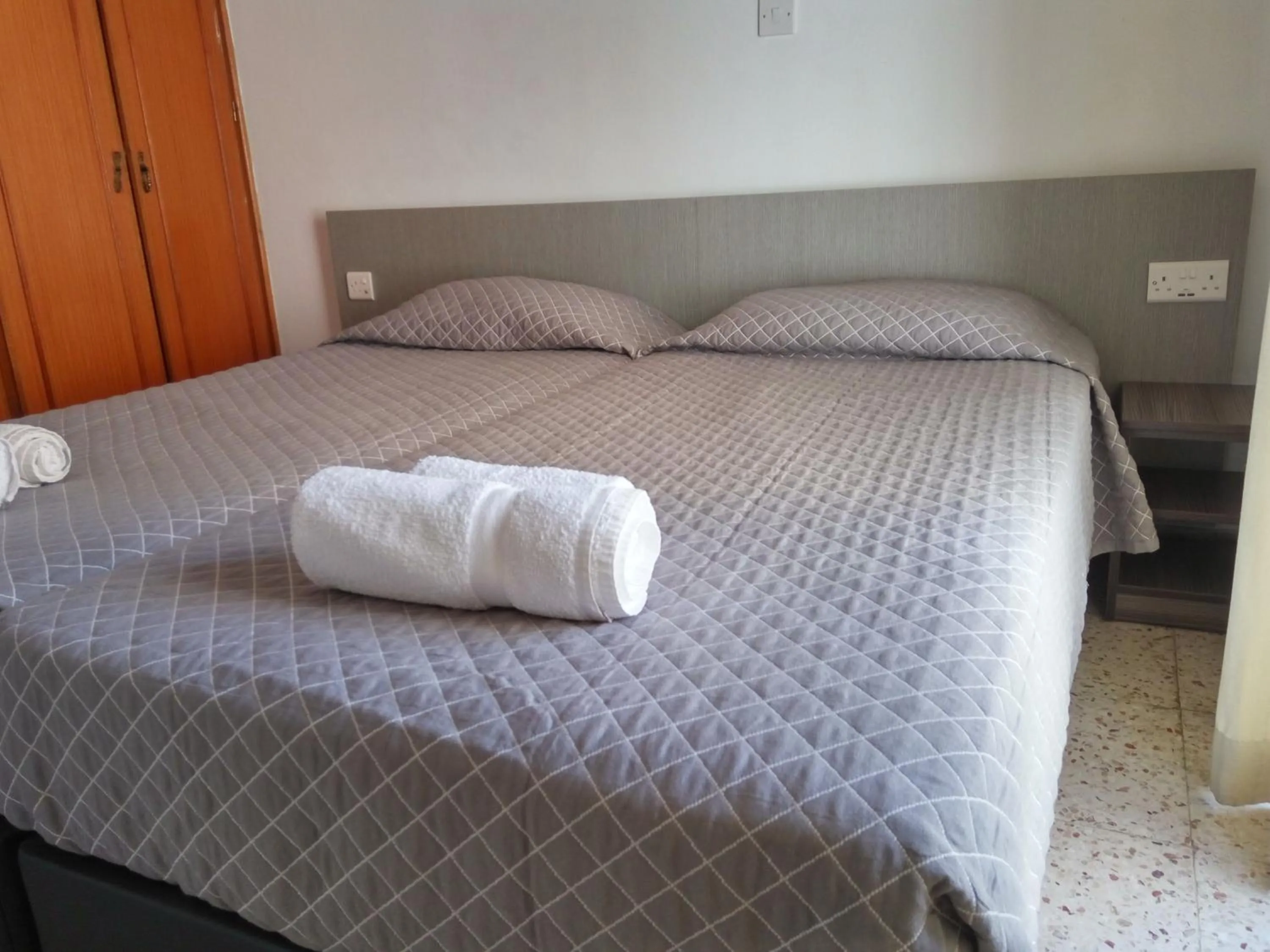 Bed in Elenapa Holiday Apartments
