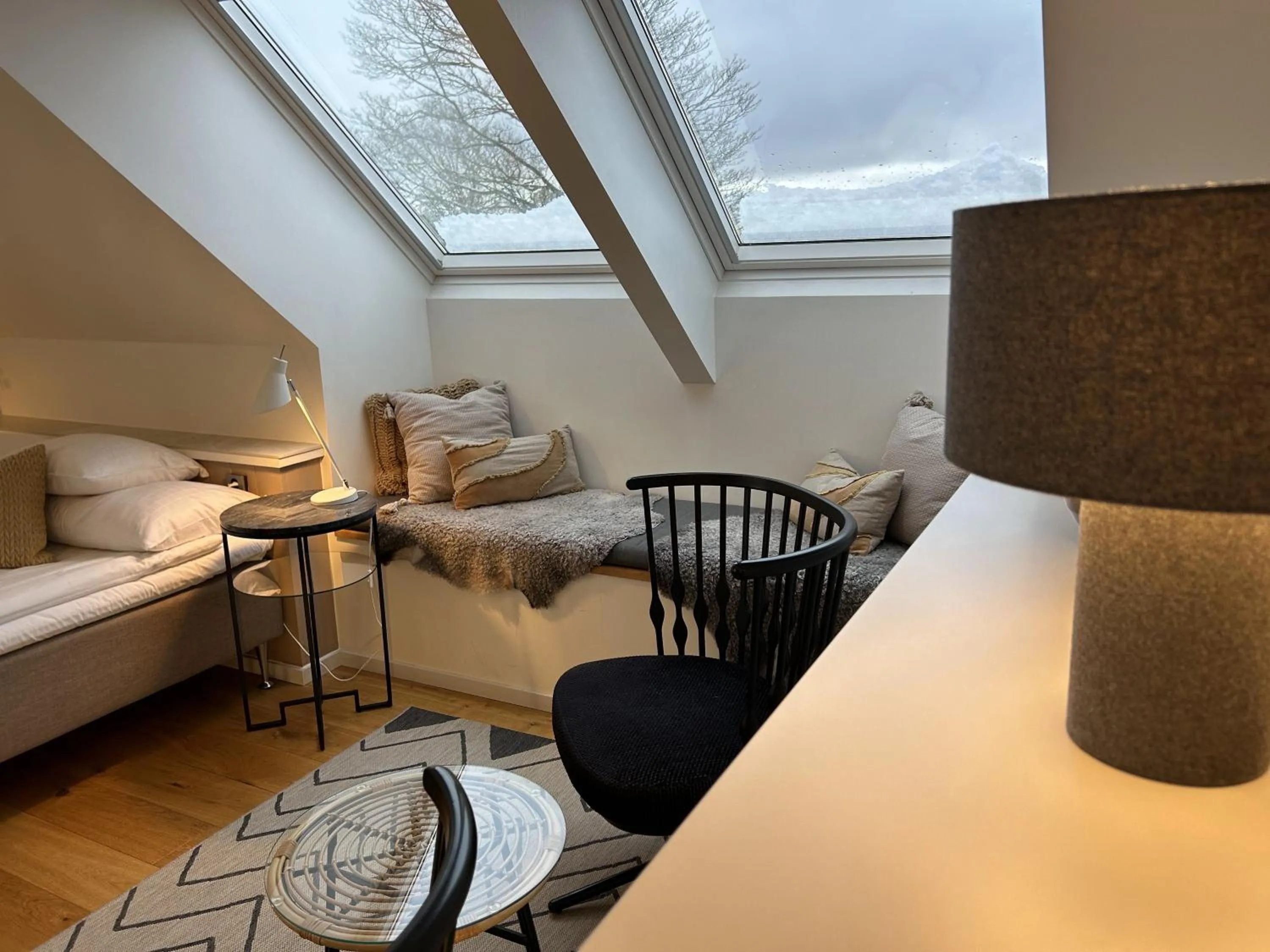 Seating area, Bed in Halmstad Gårdshotell