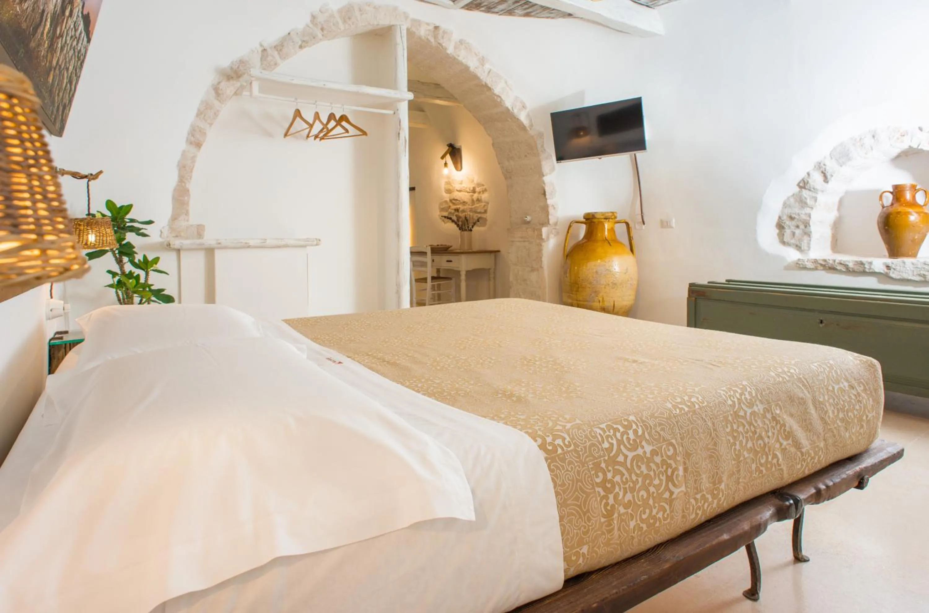 Bed in Trulli Holiday Deluxe & Wellness