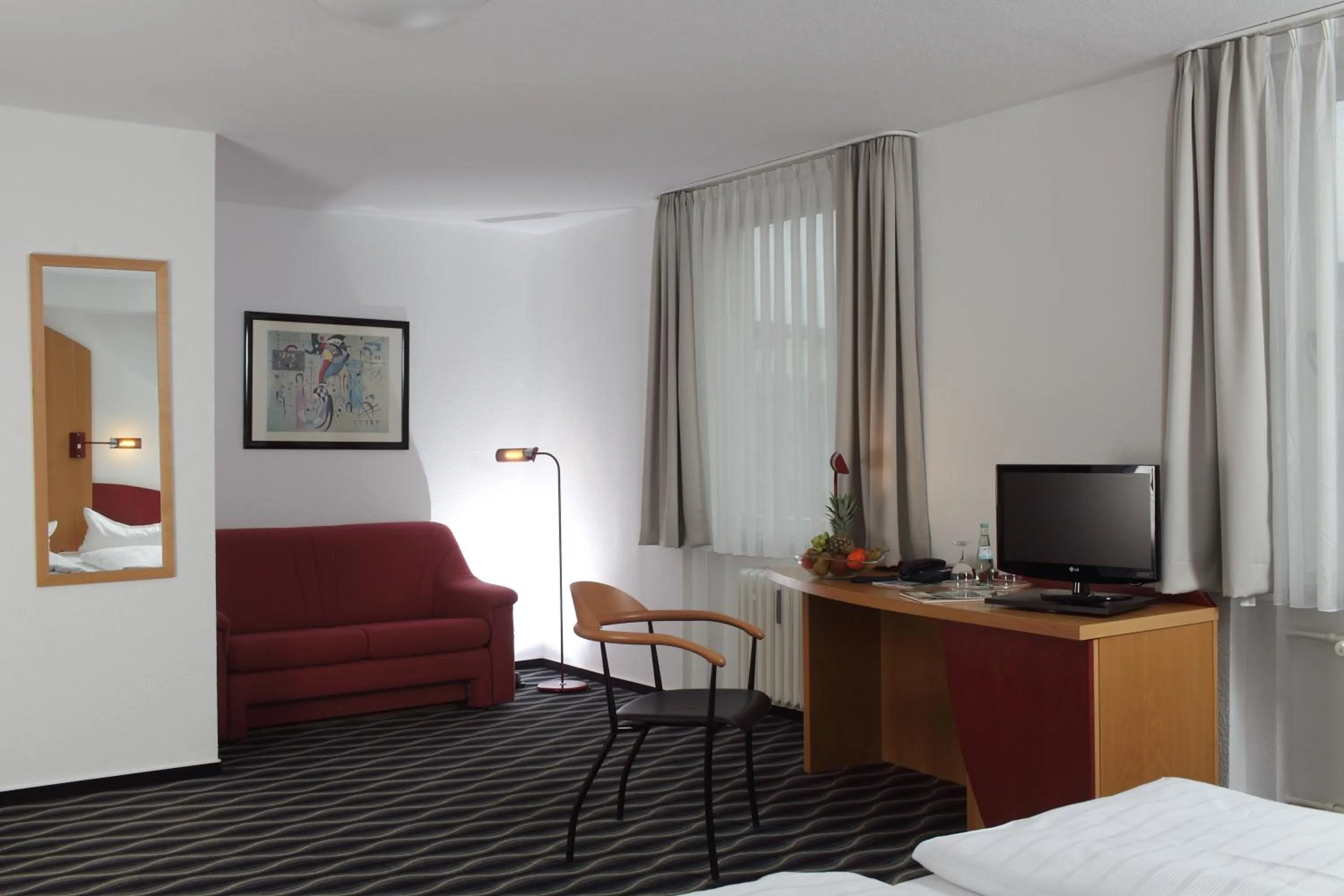 Photo of the whole room, Bed in Stadthotel Kassel