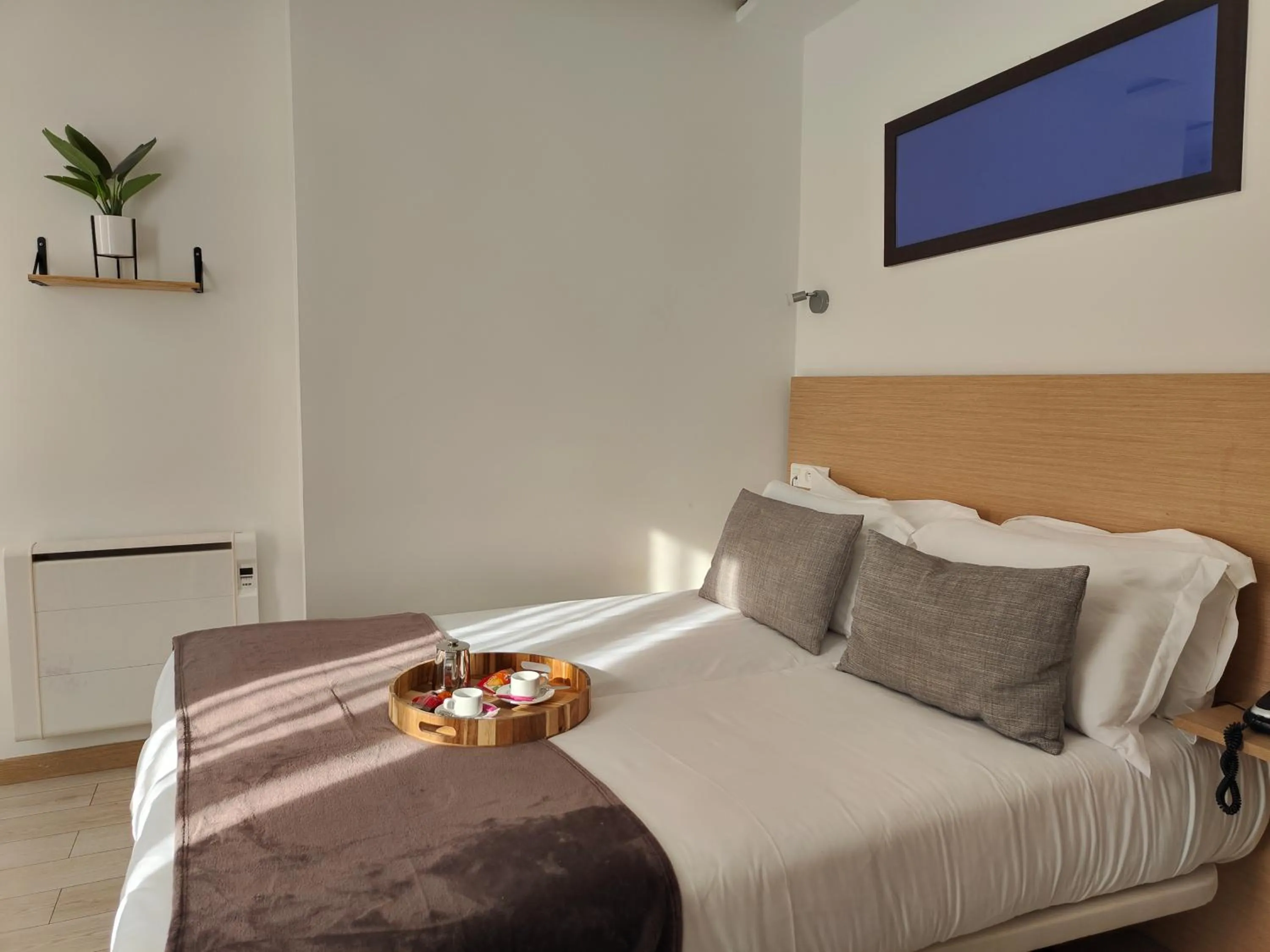 Bed in Hôtel Le National Clichy Paris