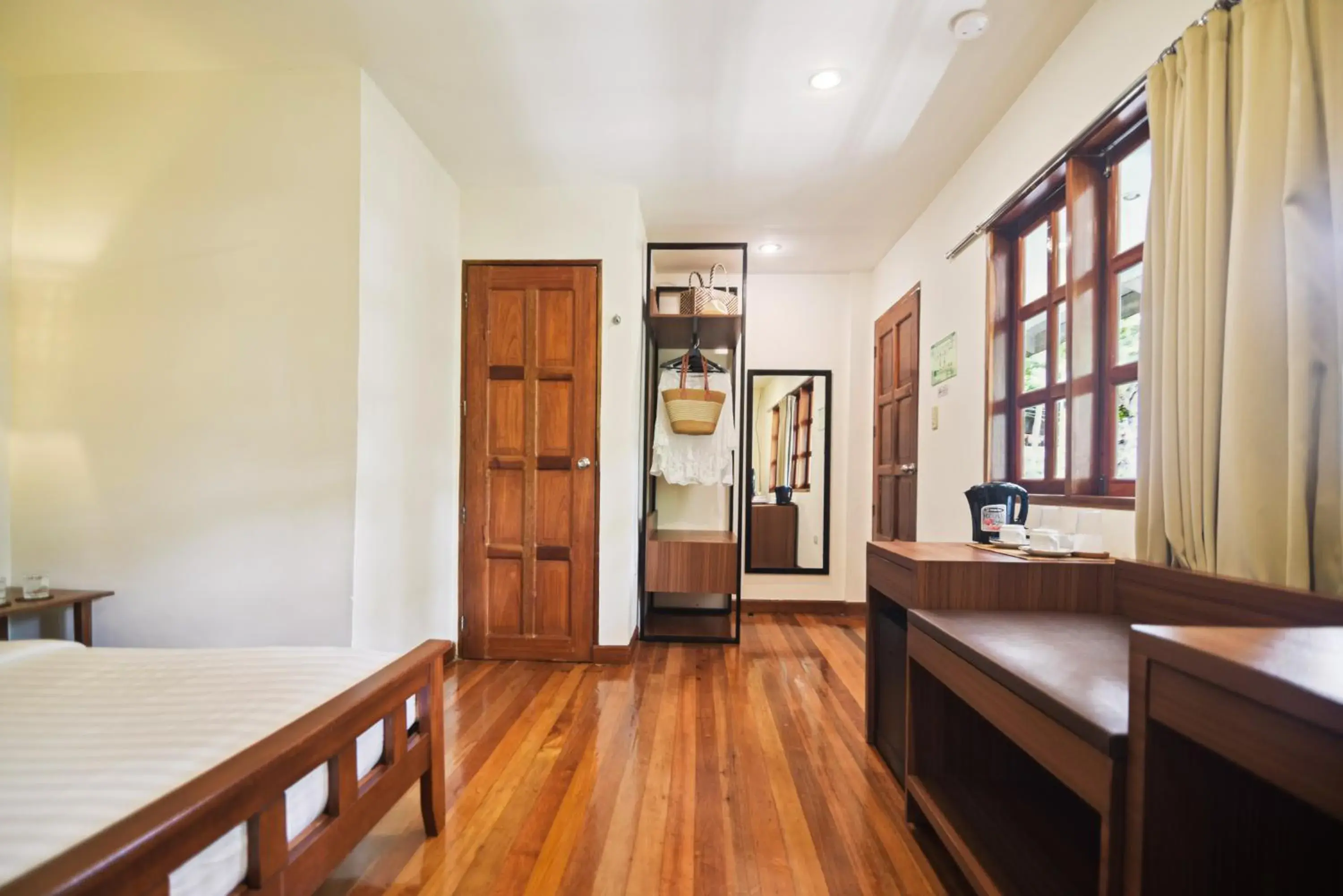 Bed in The Strand Boutique Resort Bed in The Strand Boutique Resort