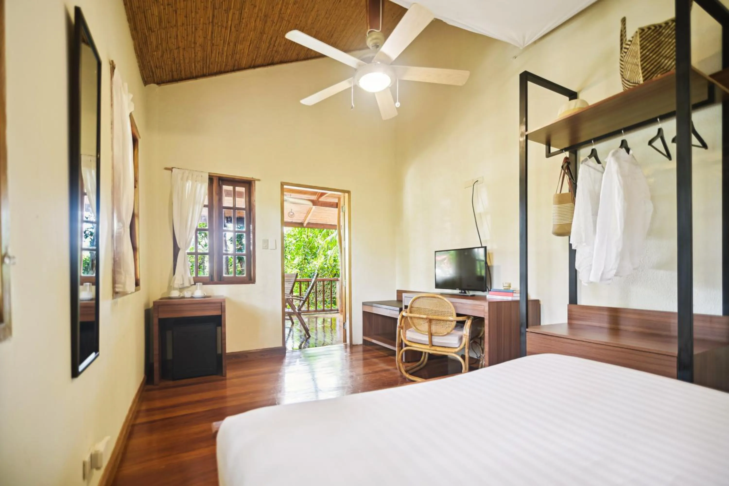 Bed in The Strand Boutique Resort