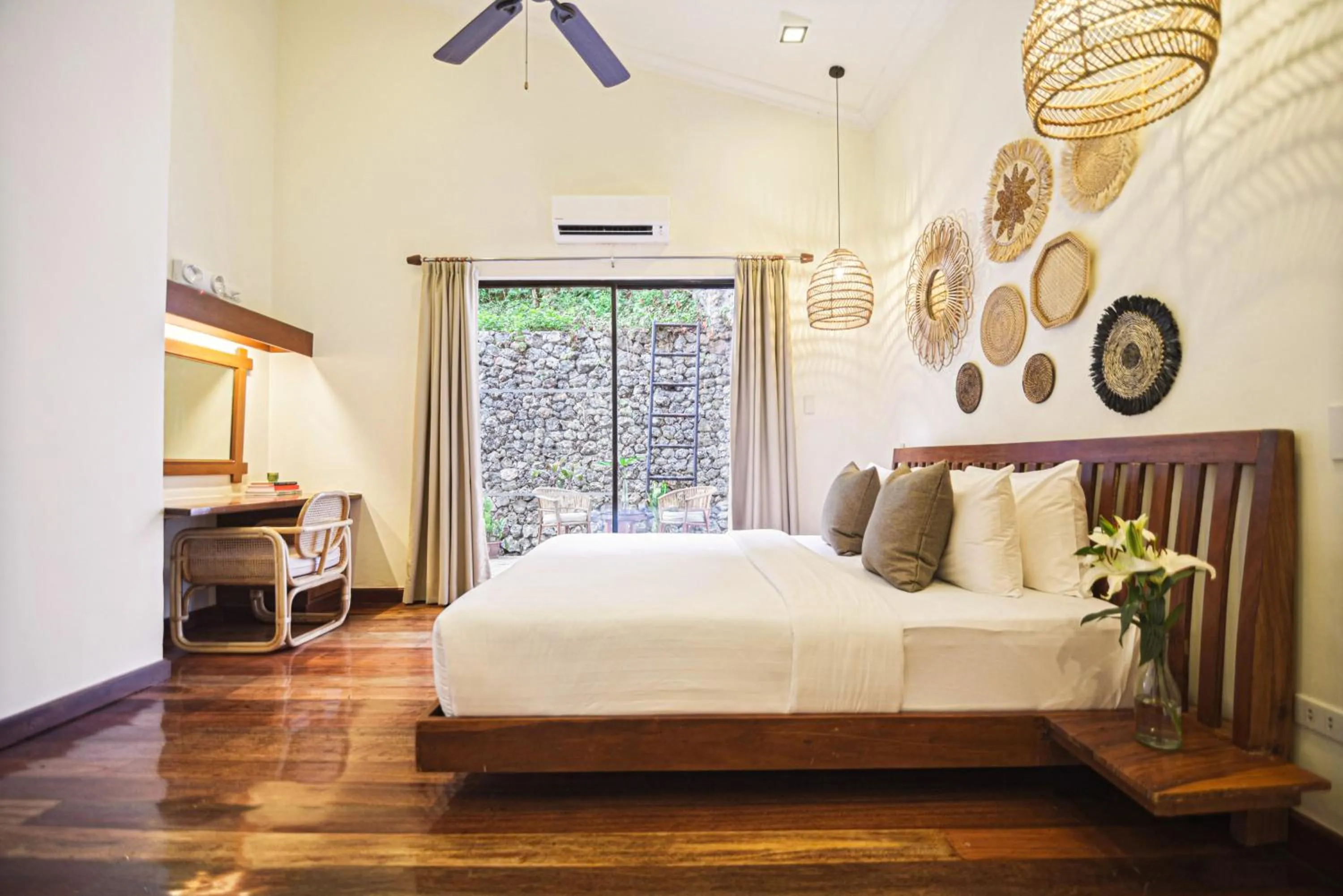 Bed in The Strand Boutique Resort