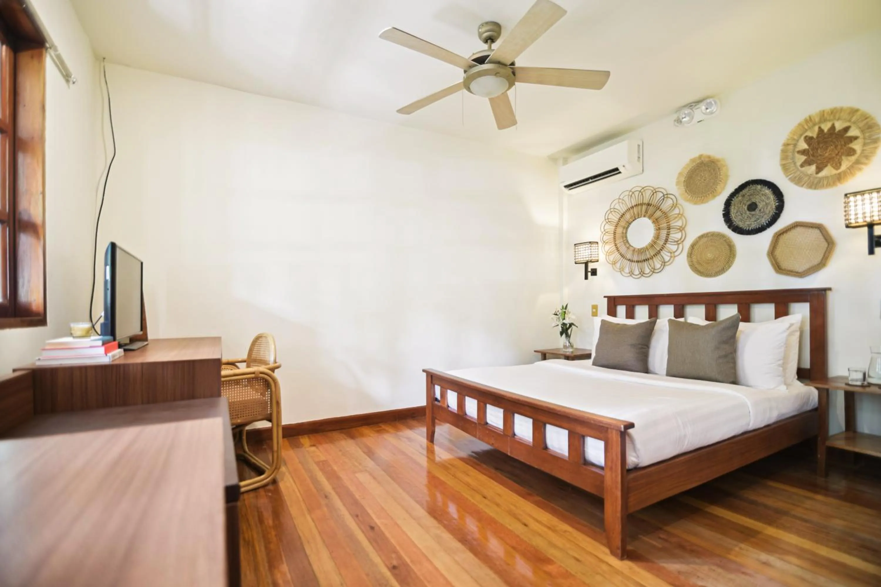 Bed in The Strand Boutique Resort