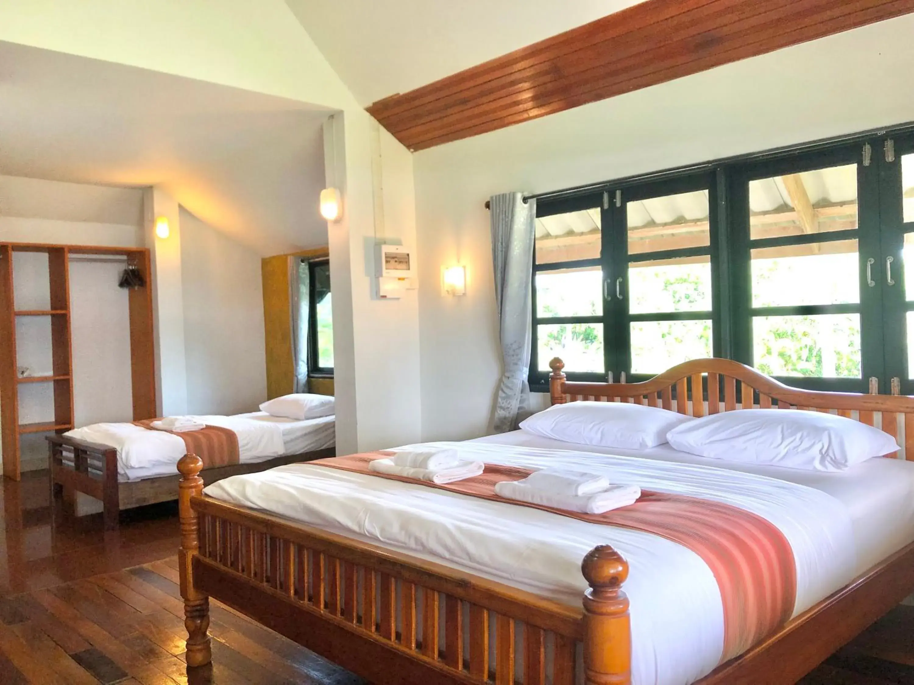 Bed in The Chevalley Beach Resort Bed in The Chevalley Beach Resort