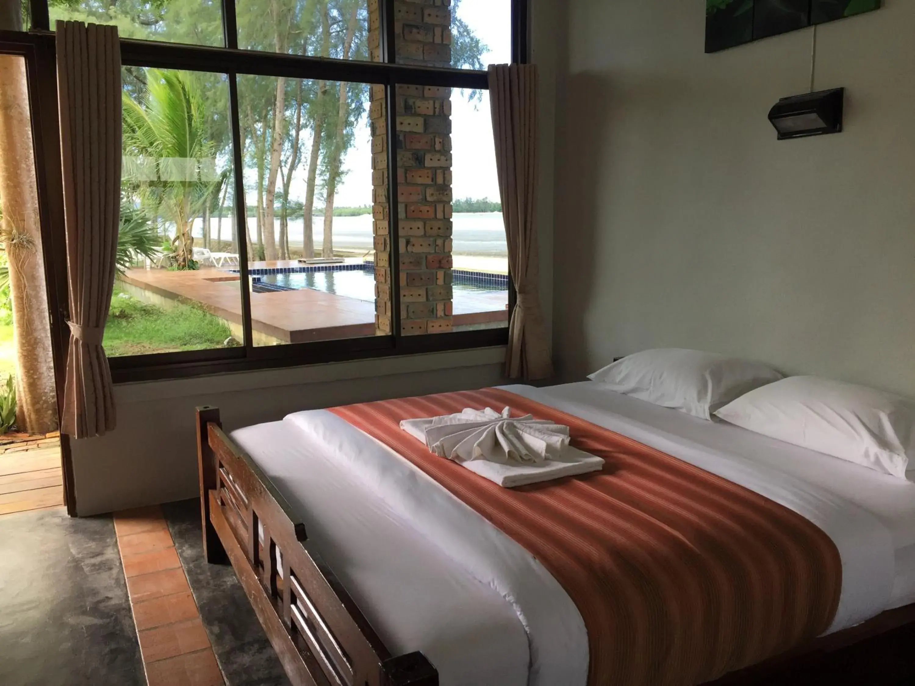 Bed in The Chevalley Beach Resort Bed in The Chevalley Beach Resort